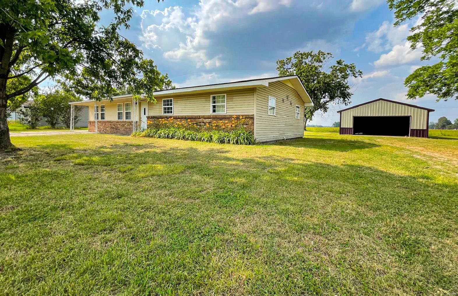 Discover the perfect blend of charm & comfort in this delightful 4-bedroom home that's just waiting to welcome you & your loved ones. Nestled in a peaceful neighborhood, this property offers a serene retreat away from town living.
Highlights:  Carpeting & Vinyl flooring new 2023 / Central heat & air new 2022 - all electric / Steel insulated front door with etched glass panel / This well quipped kitchen will be the heart of the home with ample cabinetry - including a pantry cabinet & moveable island ( lower bases, hardware & counter top, sink & backsplash - new 2022).... Range, Microwave, Dishwasher & Refrig stays with the home / Thermopane windows / Full bath remodeled in 2022 with a tub-shower combo, nice vanity, storage cabinet stays / Detached garage or workshop / Exterior is decorative brick & vinyl siding / Small storage bldg / Concrete pad great for play area.
Don't miss out on this fantastic opportunity to own a 4 -bedroom home at a great price! 
**More pics coming soon!