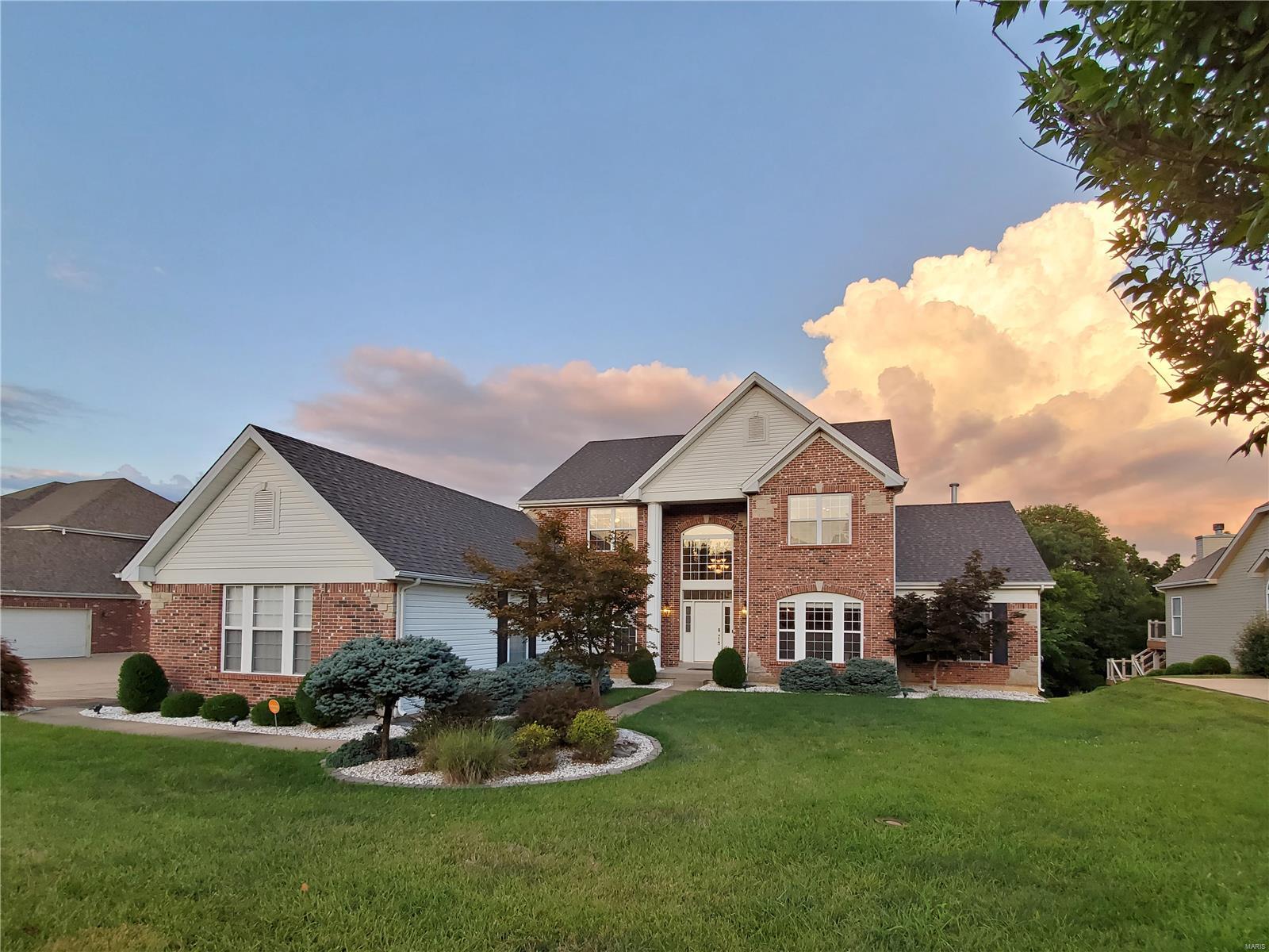 Open Sat. 11/28 & Sun 11/29 1-3p. Located in the popular golf community Tapawingo, this 1.5 story oasis awaits you! Step inside the 2 story foyer with gleaming wood floors and T staircase. Office/den with built-in cherry bookshelves, french doors, beautiful millwork. To the left is formal dining room. Circular layout takes you to great room with floor to ceiling windows featuring a private wooded view, fireplace, & wet bar. Open to breakfast room, hearth room, & kitchen featuring granite, tiered breakfast bar, planning desk, walk-in pantry, & laundry/mud room. Main floor en suite bedroom with jetted tub, separate shower, and 2 walk-in closets. Upper level contains 3 bedrooms, each with their own bathroom, & loft/sitting area. Lower Level walkout features 9' pour, theater room, wet bar, rec room, bedroom with walk-in closet, & full bath. Smart home features: Nest 3-zoned HVAC, central vac, Vivant security doorbell, smart fridge, security syst. 3 car side-entry garage. Additional Rooms: Mud Room