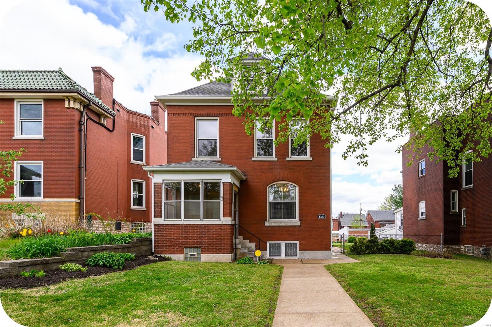 Own a piece of St. Louis history in the form of this spacious brick beauty that combines charm & character with modern convenience! Step through a handsome front door off the enclosed front porch to a large entry foyer with stunning original 3-story wooden staircase that sets the tone of the home & ties together such period elements as gleaming wood floors, intact pocket doors, era-appropriate light fixtures & decorative fireplaces with gorgeous tile & woodwork. The functional kitchen was completely redone in 2016 with classic finishes including wood cabinetry, SS appliances (all stay!), pretty counters & white subway tile backsplash. On the 2nd floor, a palatial primary bedroom boasts 2 closets & connects to a bonus room that currently serves as a huge walk-in closet & also opens to the 2-story covered back deck for amazing views. Don't forget a 3rd floor family/flex room, newer roof & gutters, huge lot, oversized 2-car garage with new door PLUS parking pad & *squeaky* clean basement!