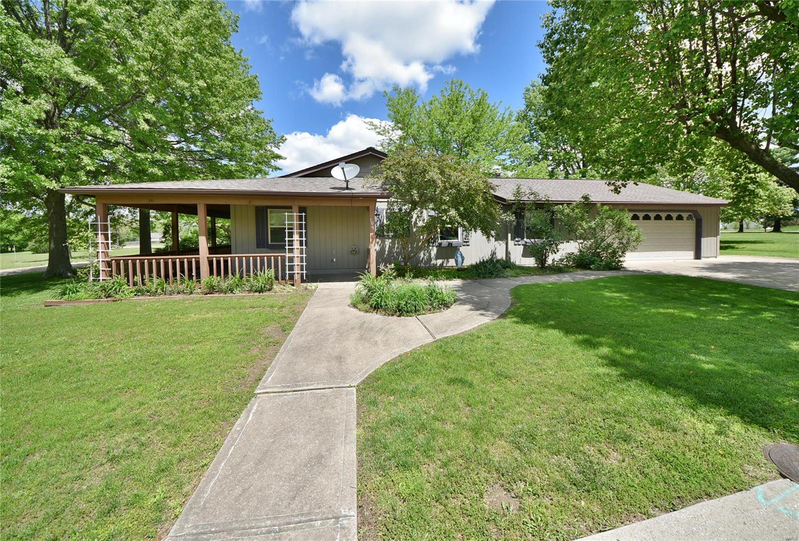 Nestled upon a sprawling 1+ acre level lot, this massive 3 bed/2 bath ranch is guaranteed to impress! You'll be greeted with a long wraparound covered front porch that welcomes you into the inviting open floorplan with a soaring vaulted ceiling stretching above the massive great room. Entertain in true style with the huge centrally located kitchen, breakfast room & dining room providing ample space for everyone during family & social gatherings. The updated kitchen boasts ample 42in custom cabinetry & ceramic tile backsplash. Stretch out & relax in the terrific family room featuring a freestanding fireplace & French double doors to the expansive covered patio. Retire in true comfort to the generously sized master suite that includes a walk-in closet & luxurious private bath with an oversized corner jet tub. Ultra-convenient main floor laundry. Giant utility shed. Coming home is always a breeze with the attached 2-car garage & additional off-street parking. Set an Appointment Today! Additional Rooms: Sun Room