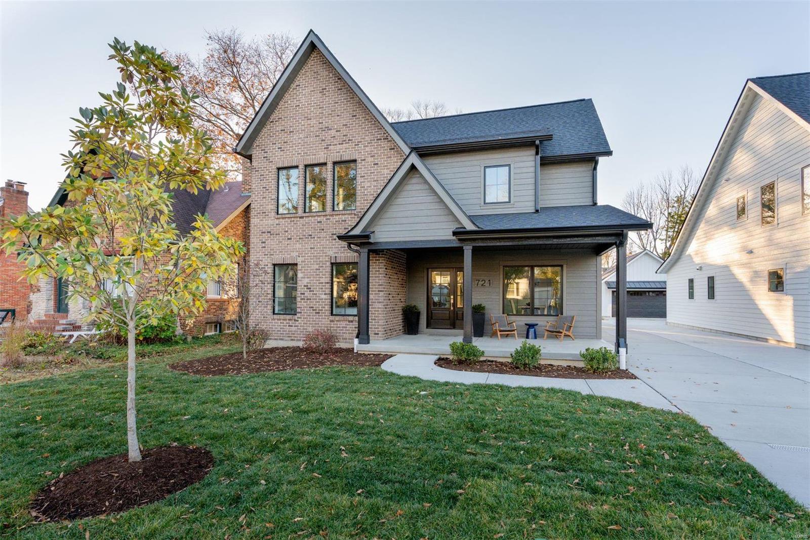 This is not your average new construction home! A well-appointed front porch sets the expectation of what lies beyond the front door. Gleaming ¾" hardwood floors, Marvin windows, and 9' ceilings are found throughout. A gas fireplace with brick surround anchors the sunlit family room, offering an abundance of entertaining space. The dramatic eat-in kitchen features wood cabinetry, quartz counters, a huge island, and Fischer & Paykel appliances. The same aesthetic carries into the butler's pantry, which flows into the DR with board and batten walls. Main floor primary suite offers a stunning bath and a walk-in closet with laundry hook-up. Upstairs is an ensuite bedroom, two additional bedrooms that share a full bath, and a laundry room. Perfect parts finished space and storage; the LL offers a 5th bedroom, large rec room, and full bath. Out back is a lovely aggregate patio and detached garage with electric car chargers. Walkable to the Kirkwood Schools and Downtown Kirkwood!