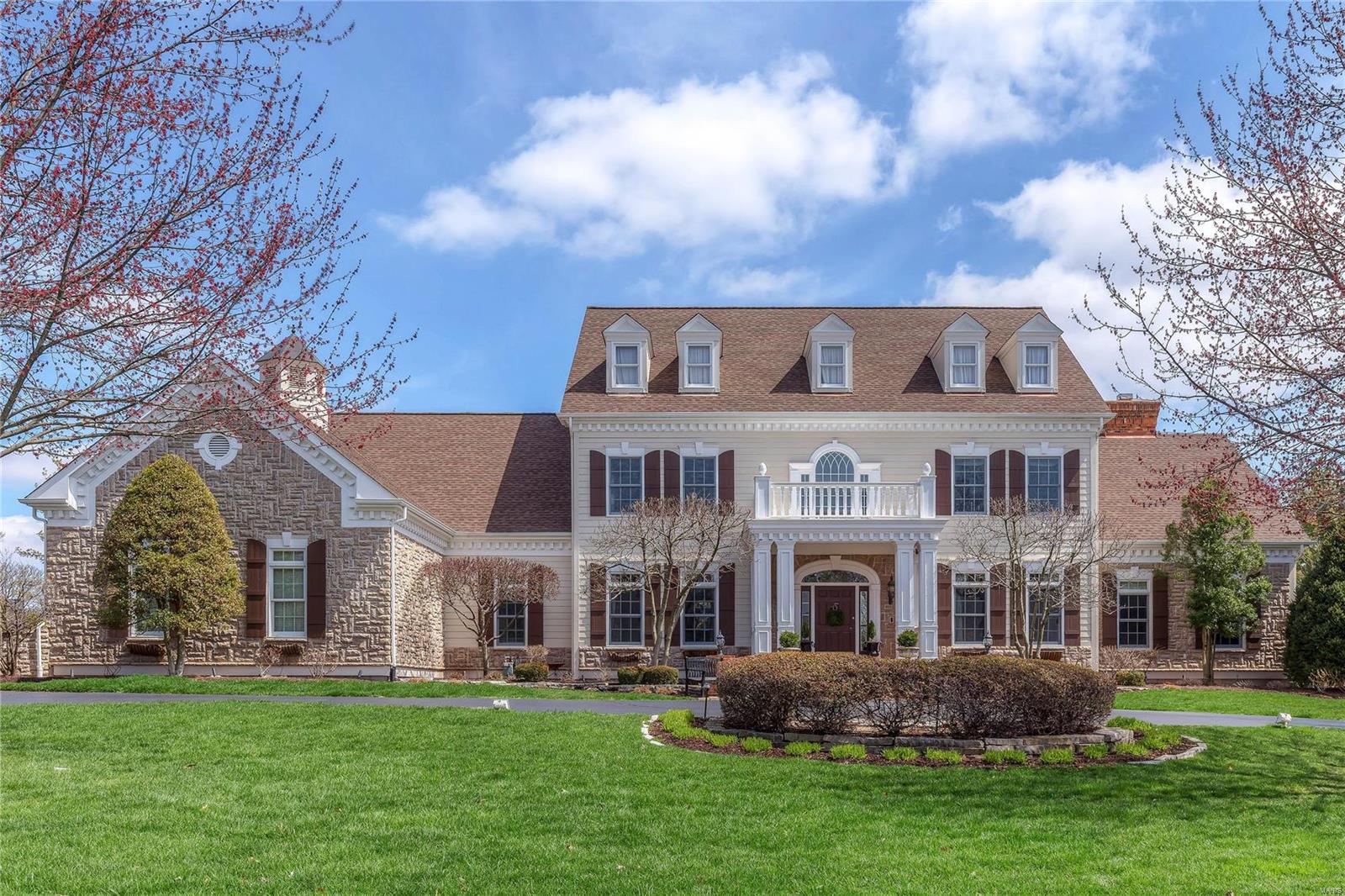 A truly magnificent Colonial in prestigious Highland Pointe! Grand 2-sty marble foyer leads to library-paneled study, elegant dining room and spectacular great room with 2-sty bow window, marble fireplace & wet bar. The main living area unfolds into the designer kitchen featuring custom glazed cabinetry, granite countertops, commercial grade appliances & butler’s pantry. Light-filled breakfast room with planning center adjoins hearth room highlighted by floor-to-ceiling stone fireplace & 3-seasons room. The coffered master bedroom suite combines the enjoyment of a see-through fireplace with a lavish bath with heated marble floor, shower spa & Jacuzzi. T-staircase accesses 3 additional bedrooms, 1 with ensuite bath & 2 with Jack n’ Jill bath. Lower Level entertainment space includes recreation room with 12’ wet bar, family room with fireplace, workout room, media room, wine cellar & full bath. Situated on a 1-acre cul-de-sac lot with patio, pool with spa, sport court & 3-car garage.