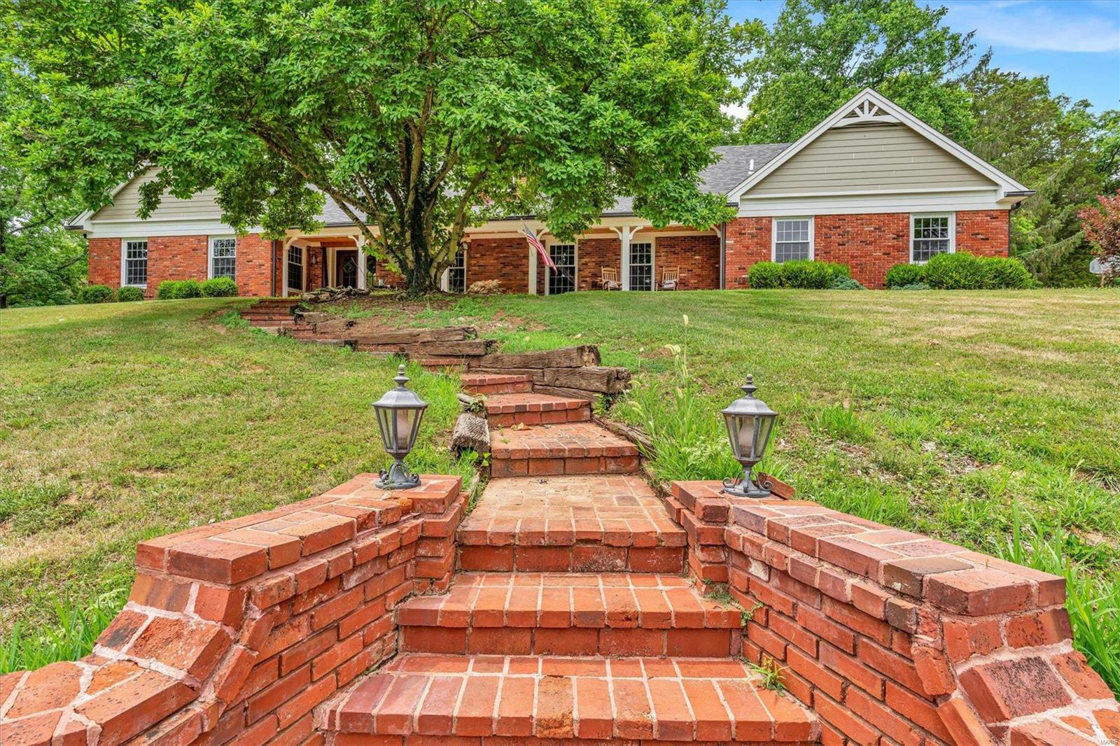 Welcome home to this amazing equestrian farm on over 10 acres. Beautiful brick home close to schools and shopping. Spacious master suite with enormous walk-in closet with built in vanity. This home features beautifully updated kitchen with custom cabinets, 2 islands, and granite countertops. charming living area and lovely office space with desk and built in shelves. Main floor laundry as well as laundry room in the basement. Upstairs includes 2 bedrooms with walk-in closets and full bath with large attic area that could be 3rd bedroom or living space. New flooring, front door, James Hardie Plank siding, sofit and facia, and 3 fireplaces. Charming brick patios around exterior. Partially finished walk out basement with plenty of space for entertaining. 32x50 Barn equipped with 4 stalls, plumbing to each. Finished tack room with bridle and saddle rack. Work bench and workshop area with 220 power 100-amp service. Plenty of pasture and riding space. Make your appointment today! Additional Rooms: Mud Room