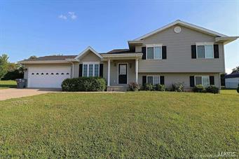 Beautiful home on large lot with 1912 square feet of living space and two car attached garage.  You will feel like you have stepped into a magazine when you enter the very trendy living room, kitchen and dining area.  The upper level has a large master bedroom with adjoining bath, additional bedroom and bath. The lower level has a spacious family room, bedroom, bath and laundry.  This home is move in ready and had a new roof in 2015 and new heating and air conditioning in 2014.