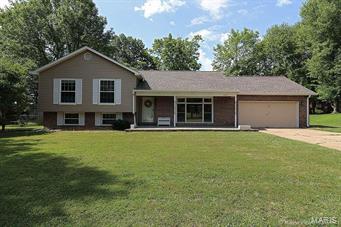 Beautiful multi-level home in desirable Holiday Park.  Home has a large fenced yard, 2 car garage with workshop and features 3 bedroom and 3 baths.  Has beautiful hardwood floors!  Full finished lower level with family room, wood burning fireplace and bathroom!