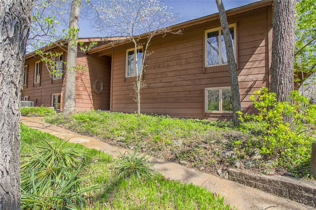 Have you ever wanted to live surrounded by parks, trees and nature yet have quick highway access?  This condo is the one for you!  This condo has an open floor plan that is perfect for entertaining.  The spacious 2 story entry is large and impressive.  The great room features a stunning fireplace and is open to the kitchen.  Two sliding glass doors open to the private deck.  The kitchen offers ample counter space and an abundance of cabinets.  The bedroom suite in extremely large, overlooks a wooded area, and has it's own bath.  The lower level family room is also spacious and offers a full bath.  The deck of one of the largest condo decks in the area. The home has central vac and an over-sized two car garage with built-in storage.  This home offers quality, style and value!  Ohlendorf County Park is adjacent to the property and Twin Oaks City Park is also close by.  There is a complex pool and tennis courts.  Close proximity to shopping, highways and restaurants. Location: Other