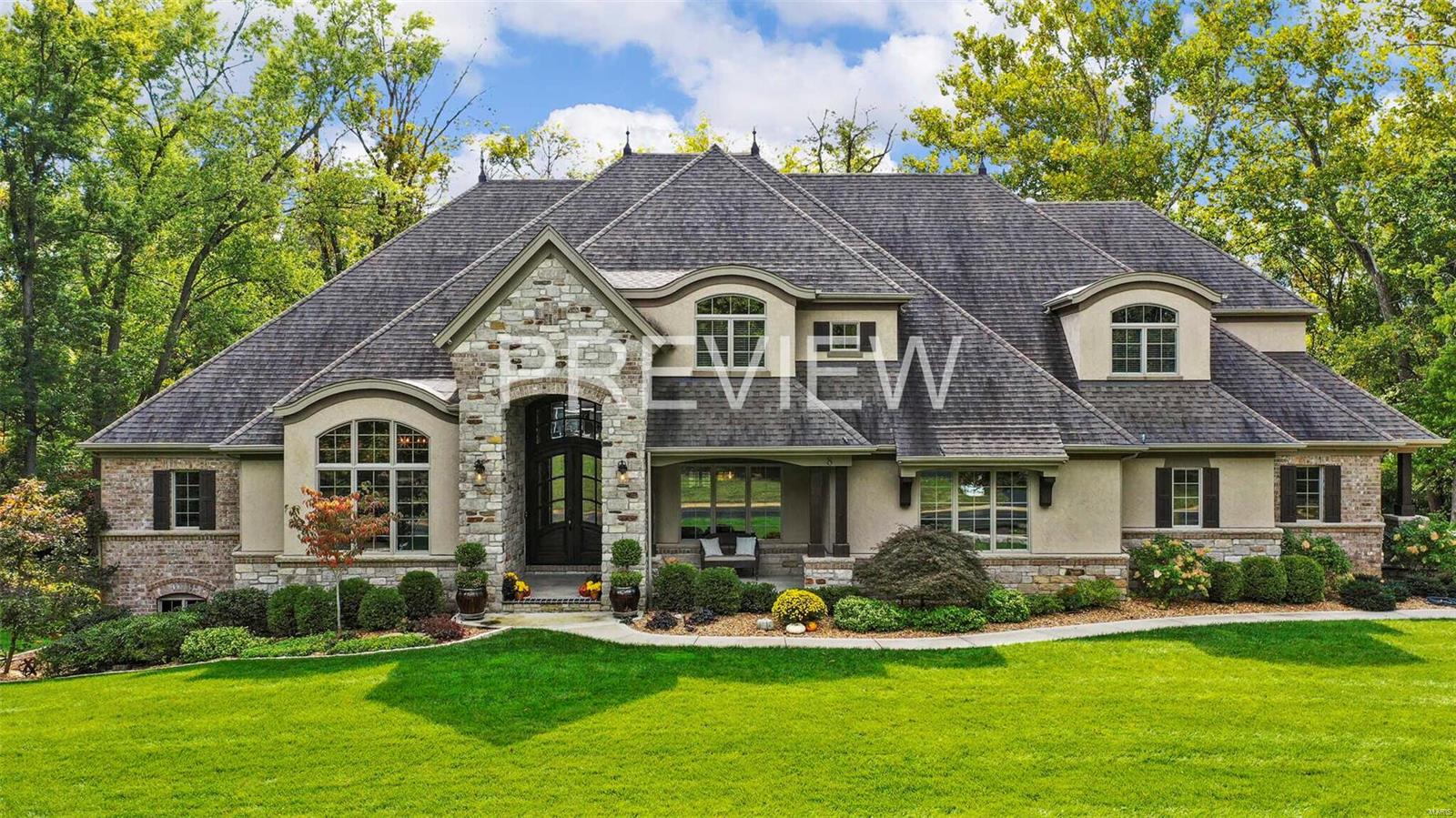 Stunning home in Frontenac is the perfect family home.  The light filled open floorplan features great room/kitchen with soaring beamed ceilings.  The kitchen is a chef's dream!  With 5 large in-suite bedrooms there's room for everyone!  A large lower-level rec room with another full kitchen and oversized workout room, opens to a covered patio. A path leads to a covered outdoor family room,/ oversized gazebo with a stone wood-burning fireplace perfect for fall or winter gatherings.  The private manicured back yard which backs to trees and has lighted trees. This completes  this stunning estate but don't forget the oversized deck off the breakfast area that lets you entertain from another stunning view of the very private back yard.   More amenities include a steam shower, off the workout area, bathrooms for every bedroom, 3 fireplaces (one gas), outdoor TV's and a oversized 3 car garage with security camera's. The home is smart wired.  A true home of distinction. Come visit- be amazed!