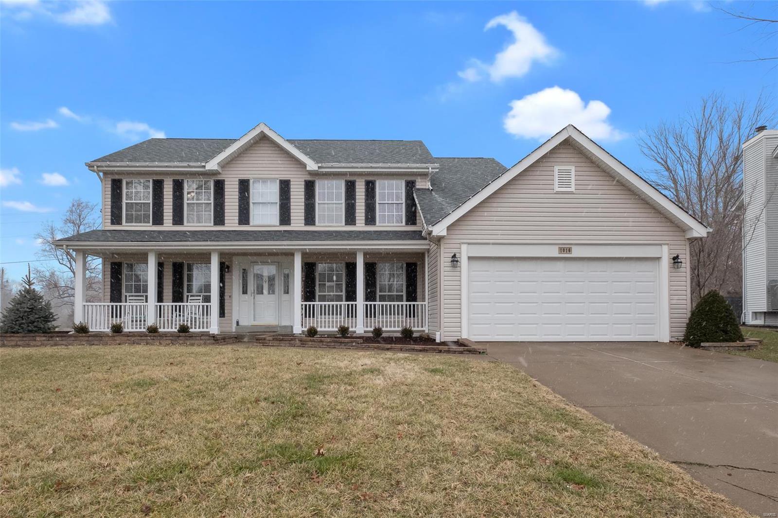 Desirable Lake St Louis home with lake rights! Stunning curb appeal! Beautiful landscaping! Renovated kitchen with granite countertops & backsplash, new 42 inch cabinetry, tile flooring, stainless appliances, gas range, and stainless hood. Other features include convenient main floor laundry with cabinetry and outside pergola.   Newer vinyl plank flooring on the main level and the secondary bathrooms have been updated.   Impressive 2 story entry foyer with an open spindled staircase takes you to the large Master Suite with 2 walk in closets and a luxurious bath with separate tub & shower.  The other bedrooms are quite spacious.  The main floor offers an office with french doors and a spacious formal dining room.  A/C 2016, new landscaping & attractive front porch spindles/railing in 2020, insulated & drywalled garage, and a fantastic large level yard with patio.  See this one before it's gone!