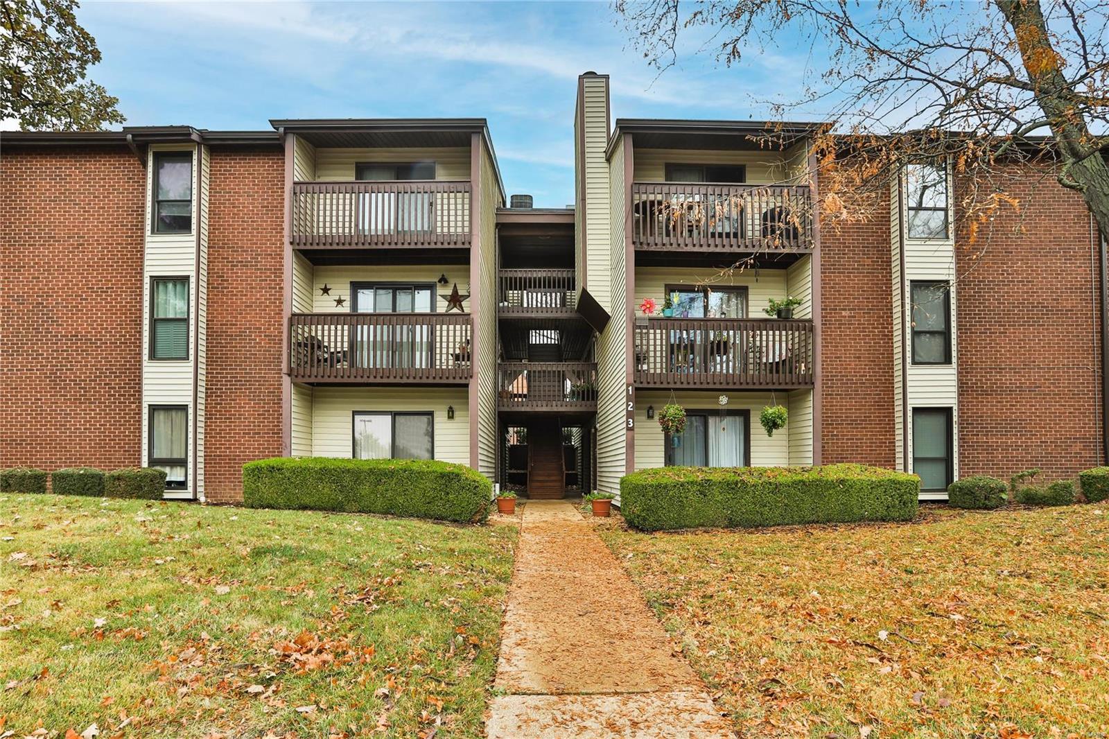 Fantastic opportunity to be within walking distance to all that downtown Kirkwood has to offer!  This well loved, super clean 2 bed, 1 bath condo is waiting for your personal touches.  Easy access from your designated parking space, as you enter into a generous living room dining combo, with access to the balcony and the perfect place to have your morning coffee.  The dining area has a shared pass through counter into the kitchen, all appliances stay (as-is). The roomy bath has a tub/shower and a stacked washer & dryer (they also stay).  The main bedroom has a walk-in closet and good size window allowing plenty of natural light.  The second bedroom has double closets and ceiling fan. The unit's utility closet is to the left of the front door.  In the building's lower level you'll find a storage locker and public washer and dryers.  Between the two buildings is a common patio allowing more entertainment space. Location: End Unit, Ground Level