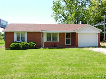 Well maintained 2 bedroom all brick home in small town.  Perfect small home for couple just starting out or anyone
looking for a payment cheaper than renting. This all brick home has real hardwood floors in the family room and one bedroom with a one car attached garage.  Huge fenced in backyard with 21x21 out building. Investors welcome great rental property.  Must see!!