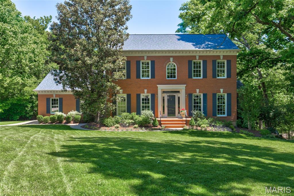 Here is a rare opportunity to acquire this stately, move-in ready custom-built home that's perfectly positioned on a breathtaking .87-acre lot in one of Kirkwood’s most picturesque and scenic settings! This beautiful home sets the stage for an unforgettable first impression both inside and out. From it’s classic exterior architecture, superior custom construction with brick facade, Palladium and double hung windows that are metal clad and wood interior; to it’s exceptional interior craftsmanship with wainscoting, crown moldings, curated finishes such as newly painted neutral walls, timeless high end porcelain tile, wool carpet, wood floors that are newly finished and paired fixtures you will have experienced this seamless impressive quality throughout. Upon entering, you're welcomed by a warm and inviting foyer that graciously introduces the well designed living spaces, showing you the heart of the home that awaits you. The quaint/cozy living room features two stunning floor to ceiling double hung windows, a simple but elegant custom wood gas fireplace with
marble surround and hearth and cove moldings at the ceiling. The dining room replicates the two stunning floor to ceiling windows and cove moldings but has an additional 3rd window (looking to the privacy of the woods) and chair rail. The open end of the dining room is situated to where it opens to the family room to see the beautiful custom crafted wood burning fireplace and to provide opportunity for larger memorable gatherings and special occasions. Extending across the rear of the home, the richly appointed family room as mentioned showcases floor to ceiling windows looking out to the back patio and woods, remarkable Amish-crafted custom cherry solid wood built-ins cabinets with shelving for display and storage for visual and audio, again the fabulous wood burning fireplace accented by exquisite 6 x 6 hand-painted Dutch inspired tile surround. Designed with both style and functionality in mind, the well appointed eat-in kitchen is sure to impress with its beautiful solid wood Cherry cabinetry (Amish-crafted!), attractive quartz countertops, 4 x 4 hand painted tiles and NEW LG stainless steel appliance package. Conveniently located off the kitchen is a stylish powder room with pedestal sink along with an adjoining oversized main-floor laundry room that enhances both practicality and everyday ease. Up the staircase awaits the spacious primary suite with three luscious light filtering windows complete with generous closets and a lovely bath featuring a spacious walk-in shower, designer cabinet vanity, stylish accent sconces and timeless porcelain tile flooring. There are three additional bedrooms each offering wonderful closet space, 2 or 3 large windows and share an equally impressive hall bath with oversized cabinet vanity, tub/shower combo and porcelain tile floor. The
expansive walk-out lower level is FABULOUS! There's abundant space to spread out offering a multitude of options for its use. It offers wonderful built-ins with sink, neutral tile floors (with radiant heat!), spacious FIFTH bedroom with a private ensuite bath showcasing a pedestal sink, walk-in shower, and attractive tile flooring. The spacious, attached side entry 3 stall garage is conveniently located off the back hall and side entry door. The backyard oasis is truly SPECTACULAR! Its highlighted by a main floor walk out to a nicely sized patio overlooking the private paradise with terraced landscaping and stone pavers that lead down to the lower level patio where there is yet another walk out to the serene property.
Not to miss: newly sealed aggregate driveway, Roof (2024), Trane HVAC (2024), Central Vac and FABULOUS location!