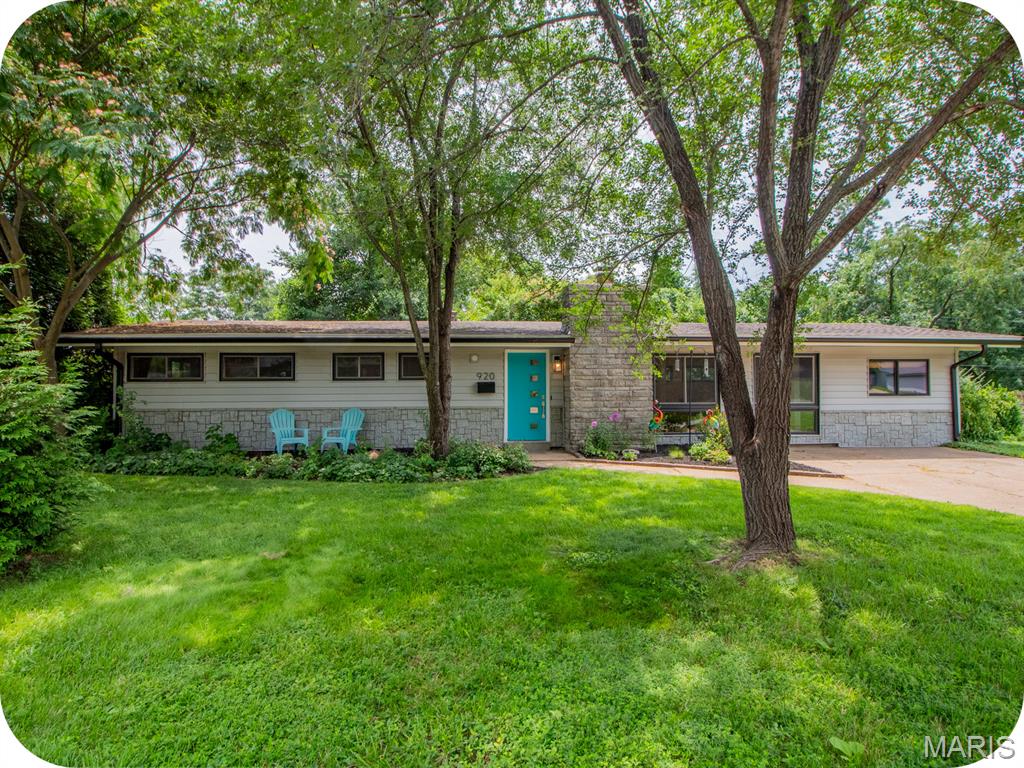 Welcome to 920 Volz Drive, a picture-perfect corner lot in Crestwood's Ridgewood neighborhood, known for its mid-century character, located in the Lindbergh School District, with easy access to shopping, dining and everyday conveniences. This remodeled ranch home is move-in ready with a two year old roof, updated kitchen and bathroom, and newer flooring and lighting throughout. Walking inside, the vaulted ceilings showcase a surprisingly flexible open layout designed for those who love to gather, with four distinct living zones; a fireplace sitting nook, a secondary gathering space, a dedicated dining area, and a main living room, all of which flows into a bright updated kitchen with quartz counters, stainless steel appliances, generous cabinet space and a breakfast bar for additional seating. Sliding glass doors lead to a large patio, ready for summer cookouts, and a fenced back/side yard, with plenty of room for the dogs or kids to play (and don't miss the shed for additional storage). Single-level living means everything is right where you need it, with three bedrooms, an updated full bathroom with gorgeous sage green subway tile, and a convenient main floor laundry room. A versatile bonus room adapts easy to a home office, gym, art studio, or a fourth guest bedroom. With mature trees, including a weeping willow and towering pine, and a native garden, some houses just feel like home before you've even stepped inside. Schedule a tour with your favorite Realtor today.