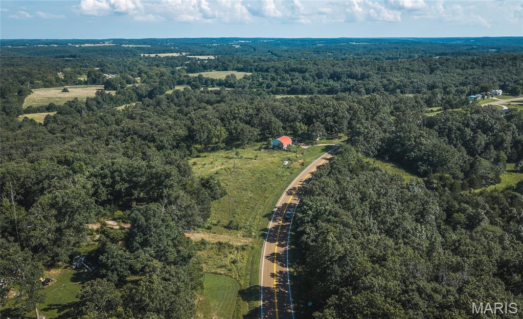 This 115-acre m/l hunting property offers outstanding deer and turkey hunting with unlimited potential in a highly private setting. Located just off Highway 17 near Iberia and convenient to the Lake of the Ozarks, the property feels remote and secluded despite its easy access.

The land features excellent trail systems throughout, several well-defined pinch points, and multiple natural stand locations that make it a serious hunter’s paradise. Over 20 acres of open pasture along the creek bottom provide great feeding areas and visibility, while the remaining timbered acres offer thick cover and bedding habitat.

In addition to the strong hunting, there are several beautiful home sites with nice views and easy building potential. Whether you’re looking for a full-time residence, weekend cabin, or long-term hunting retreat, this property has the layout and location to make it happen.

A solid, versatile tract with good trails, productive bottom ground, and privacy — ready for serious hunters or those wanting to create their own private Ozark getaway.