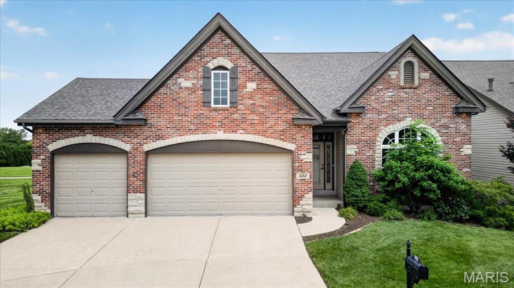 Experience luxury lakeside living in this stunning story-and-a-half villa designed with both elegance and comfort in mind. From the moment you step inside, you’ll be captivated by the abundance of natural light, soaring ceilings, and beautiful open spindle staircase that creates a dramatic focal point in the home. The gourmet kitchen is a chef’s dream, featuring custom shaker cabinetry, granite countertops, a spacious center island with breakfast bar seating, stainless steel appliances, a five-burner gas range with vent hood, and double wall ovens—perfect for entertaining or everyday living. The inviting great room offers a cozy gas fireplace and seamless flow throughout the open-concept main living space. Retreat to the luxurious main-floor master suite complete with an electric fireplace, spa-inspired soaking tub, separate shower, and walk-in closet. Main-floor laundry adds everyday convenience. Upstairs, you’ll find two additional bedrooms, a full bathroom, and a versatile loft area ideal for a home office, media space, or reading nook.
Additional highlights include a three-car garage and an unfinished walkout basement overlooking the lake, offering endless possibilities for future living space and breathtaking views year-round.
This exceptional villa combines timeless design, upscale finishes, and serene lake views in one remarkable property.