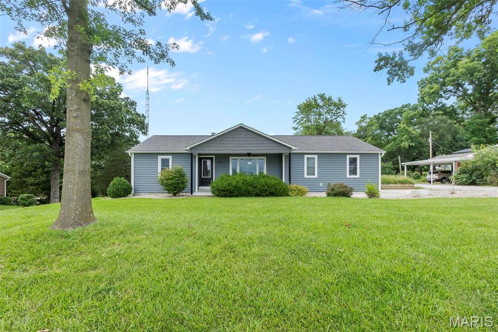 Situated on the edge of city limits, this charming 3 bedroom, 3 bath home offers plenty of space both inside and out. As you walk in, you'll appreciate the open-concept kitchen and family room, main-level laundry, and primary suite. Sitting on nearly half an acre, the property features a two-bay detached carport and an additional concrete pad for camper storage or future outbuilding plans. 
This home has seen several major updates within the last few years, including a newer roof, the addition of the primary suite, new exterior siding, a covered front porch, and more. With room for you to spread out and enjoy, this is a home you won't want to miss.