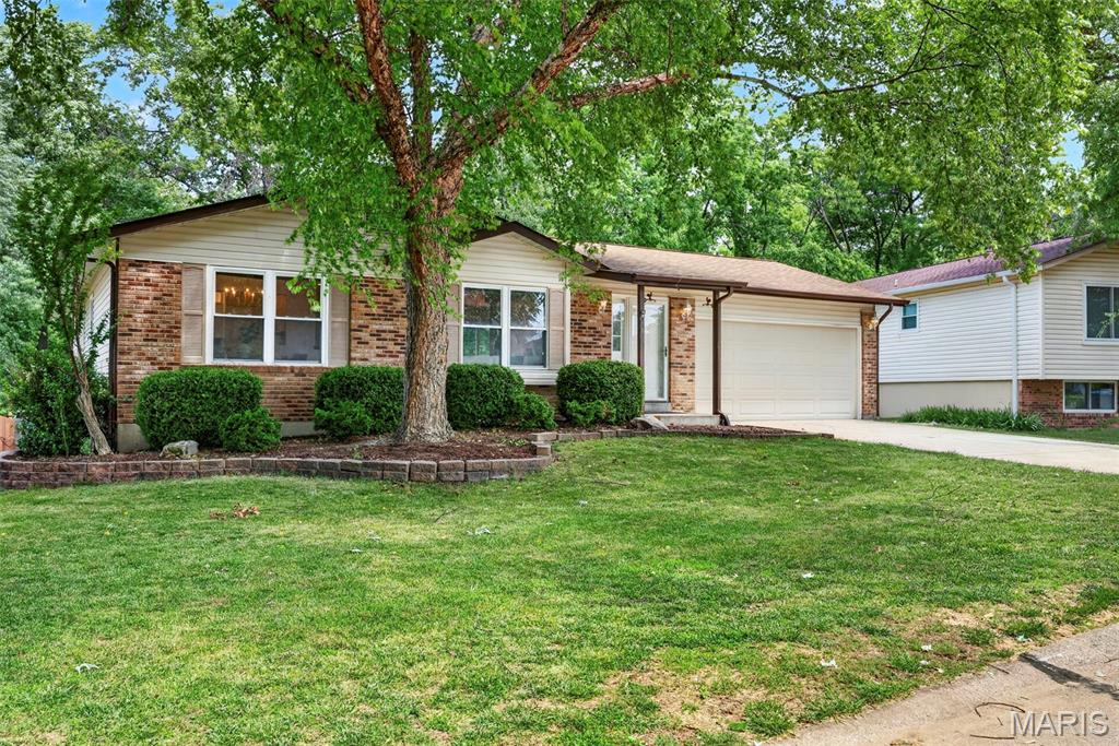 This is the one you've been waiting for! Beautifully renovated and move in ready, this stunning ranch offers an open floor plan, a walkout basement, a massive fenced yard backing to woods, and an unbeatable St. Peters location close to shopping, schools, restaurants, and major highways.

Step inside to discover a bright and inviting living space featuring large vinyl windows, neutral decor, updated lighting, and stylish wide plank luxury vinyl flooring throughout. The custom kitchen is sure to impress with slow close cabinetry, sleek countertops, stainless steel appliances, a designer backsplash, and plenty of workspace. The kitchen flows seamlessly into the dining area, making it perfect for both everyday living and entertaining.

The spacious great room provides plenty of room to gather and opens directly to the oversized 18x22 deck overlooking the level fenced backyard and wooded backdrop. Whether you're enjoying your morning coffee, hosting friends, or simply relaxing outdoors, you'll love the privacy and peaceful setting.

The primary suite serves as a private retreat with two closets and a beautifully updated en suite bath featuring a tiled shower and new vanity. Two additional bedrooms and a second fully renovated tiled bathroom complete the main level.

The finished walkout lower level adds even more living space with a large recreation room that's perfect for movie nights, game days, or entertaining. French doors fill the space with natural light and provide direct access to the backyard and patio. You'll also find an additional finished room that would make an ideal home office, guest room, fitness area, playroom, or hobby space. Between the spacious closets, abundant storage in the lower level, and the large storage shed out back, you'll actually be able to use your two car garage for what it was intended for... parking!

From the stunning updates throughout to the incredible outdoor living space and private wooded views, this home truly has it all. Don't miss your chance to make it yours. Join us at the open house Saturday 6/20 from 12:00-2:00pm!