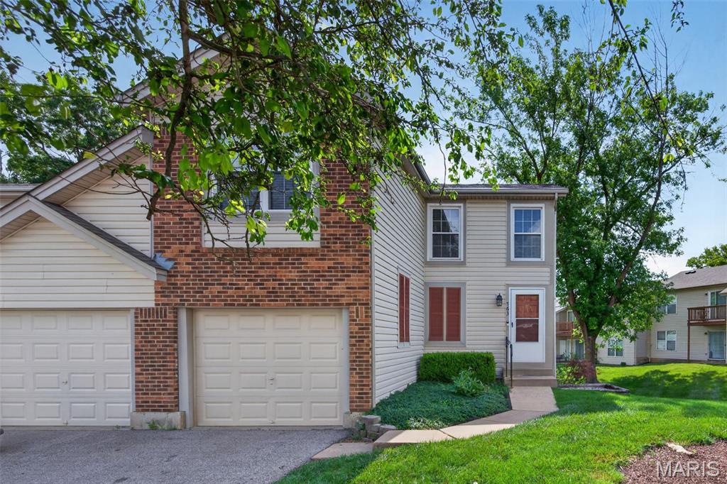 Welcome to this beautifully updated townhome offering nearly 1,500 square feet of stylish living space in the highly desirable Sugarwood subdivision within the Francis Howell North School District. This move in ready home features 2 bedrooms, 2 full baths, 2 half baths, and a 1 car garage with numerous updates throughout. The dramatic two story living room showcases wood flooring, professionally painted walls, and an open layout that flows seamlessly into the kitchen and breakfast room, creating the perfect space for everyday living and entertaining. The updated kitchen features 42 inch cabinetry, stainless steel appliances, ceramic tile backsplash, wood flooring, and a sliding glass door that opens to a spacious composite deck. The laundry room is conveniently located on the main level, along with an updated half bath featuring an adult height vanity, modern lighting, updated fixtures, and wood flooring. Upstairs, both generously sized bedrooms offer LVP flooring, ceiling fans with lights, and private en suite baths, providing comfort and convenience. The partially finished walk out lower level expands your living space with a spacious family room featuring LVP flooring, an office located just off the family room, and an additional half bath. Enjoy low maintenance living with outstanding community amenities including an inground swimming pool and clubhouse. Conveniently located near shopping, dining, parks, and major highways, this exceptional townhome combines tasteful updates, modern finishes, and an unbeatable location in one of the area's most sought after communities.