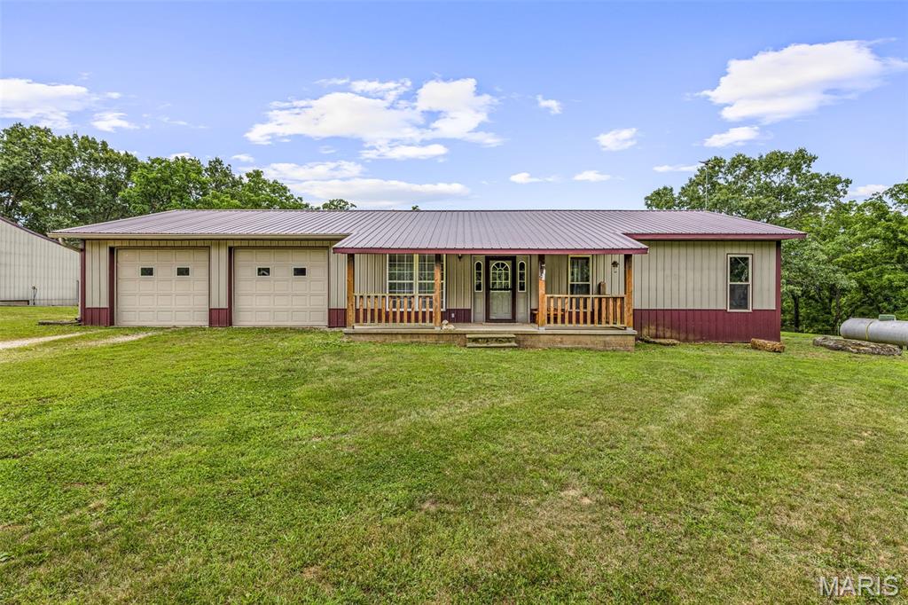 Peaceful country living awaits on this stunning 15.32-acre ranch property—an equestrian enthusiast’s dream! The acreage is fully fenced and cross-fenced with electric fencing, ready for horses or livestock.
This well-maintained ranch-style home features 3 bedrooms and 2 bathrooms, along with an oversized, climate-controlled attached 2-car garage. Inside, you’ll find an inviting eat-in kitchen with ceramic tile flooring and direct access to a covered back porch—perfect for enjoying serene views of the property. The great room boasts a vaulted ceiling, large windows for abundant natural light, and plush neutral carpeting. Accent lighting throughout the home adds warmth and charm.
Both bathrooms include ceramic tile flooring and spacious linen closets for added storage.
The impressive detached building is heated and cooled, includes a half bath, and offers tandem parking with four oversized electric garage doors—ideal for equipment, vehicles, or workshop space.
Equestrian amenities include a barn with three horse stalls and a tack room designed to meet every rider’s needs. A small pond enhances the property's natural beauty, making it a true nature lover’s paradise.
Additional highlights include updated HVAC and updated, durable metal roofs on all three structures. Move-in ready and set in a tranquil setting—this property is the perfect blend of comfort, functionality, and country charm.