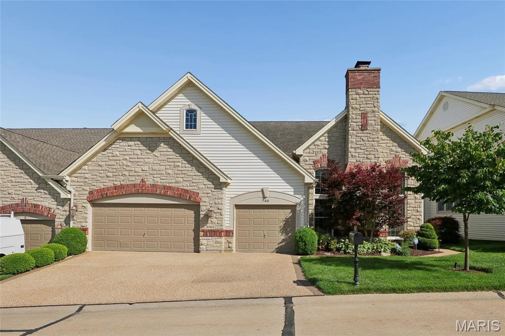 Simply lovely.  This beautiful villa is well constructed with an abundance of quality.  High ceilings, Lots of light streams from the windows on three sides, quality built ins, wood flooring, moldings, lighting fixtures, the list goes on and on.  Located in a private gated community off of Baxter Road and within walking distance to the new downtown Chesterfield entertainment complex.  This 1.5 story plan offers a main floor master with an open floor plan that allows you to enjoy just the first floor for you daily use.  Center hall entry with large living room with fireplace and wood floors.  Formal dining room with wood floors.   Center hall leads to large great room with 20+ ft ceiling, wall of windows to the rear overlooking deck, fireplace with built in to each side, wood floors and wet bar area with built in ice maker.  The kitchen is wonderful with large center island with second sink, custom cabinetry with great built ins, granite counters, stainless appliances, gas cook top with hood, 2 ovens, microwave, warming drawer, 2 refrigerated drink drawers and built in sub zero. Delightful sundrenched breakfast room leads out to deck.  The first floor master suite is a dream.  Very spacious and has wood flooring, two walk in closets that have customized shelving, and a private master bath that is simply over the top with dual vanity areas, whirlpool tub, walk in shower, private commode area, and linen closet.  The master bath connects through a side door to the first floor laundry.   When company comes, there is a 2nd floor complete with 2 bedrooms each with their own in-suite full bath.  Additionally there is a small loft perfect for work area.  The finished lower level is finished with a family room and 3rd fireplace, rec area, bedroom with private full bath, full kitchen/bar area, and half bath.  This area does walk out to a large private patio. 3 car garage with finished floor, walls and ceiling with pull down attic stairs.  In addition numerous built in cabinets and work bench.  Seller will consider seller all furniture with a few piece excluded for sentimental reasons for an additional price.