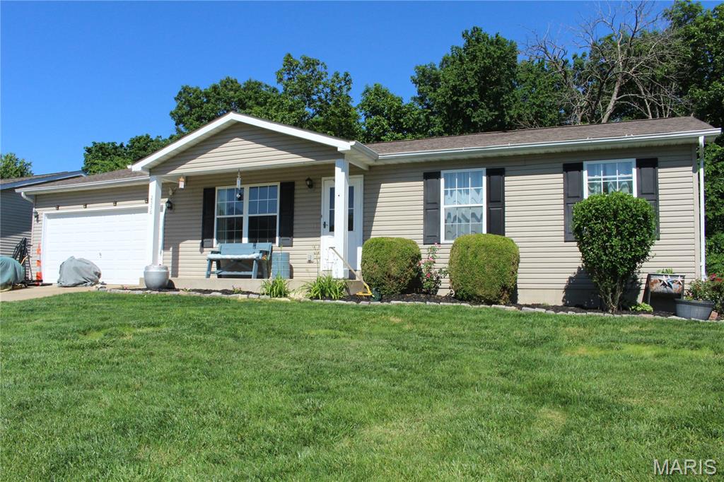 Welcome to this awesomely well-maintained 3+ bedroom, 2.5-bath ranch that offers comfortable living close to town with a 2-car attached garage. It is freshly painted and ready to move in.  The main floor features new laminate flooring and a bright and comfortable primary bedroom with ensuite bath.  The spacious eat-in kitchen features custom laminate countertops and access to the deck for relaxing in your private yard backing to woods. The walk-out basement is finished to include a bonus room and half bath and additional framing awaiting your final finish.  The safe in the basement stays!  Your backyard includes an oversized back patio and an outbuilding for all your tools and toys.