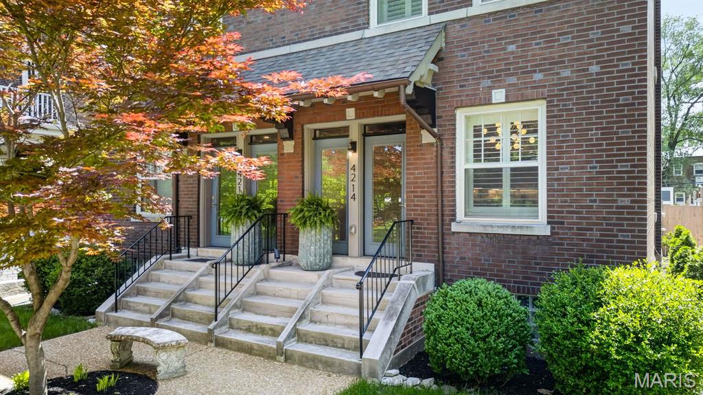A designer-renovated home for those who want the park, the city, and a little everyday magic. Perfectly positioned across from Tower Grove Park, 4214 Arsenal invites a lifestyle of morning walks beneath the trees, farmers market Saturdays, South Grand dinners, and a leafy green escape just outside the front door. Inside, this beautifully renovated home blends historic St. Louis character with a polished contemporary edge - exposed brick, antique mantels, custom tile, curated lighting, and finish selections by Doug Ong of DNDO Design LLC, creating a space that feels both soulful and sophisticated. The main level was made for connection, with open living and dining spaces anchored by a dramatic chef’s kitchen featuring a Viking range, GE appliance suite, pot filler, custom cabinetry, and statement finishes. A mudroom and powder room add modern function. Upstairs, three bedrooms and two full baths include a restful primary suite with custom tiled shower and clawfoot soaking tub. The walk-out lower level offers wonderful flexibility with a kitchenette, full bath, and studio-style living space - ideal for guests, multigenerational needs, a private work-from-home retreat, creative studio, or possible rental/revenue use with proper approvals. With two decks, a rare 2-car garage, and direct access to the best of Tower Grove living, this home is also beautifully connected to BJC, SLU, Cortex, WashU Medical Campus, Missouri Botanical Garden, and the Tower Grove Connector/Great Rivers Greenway route extending toward Cortex, MetroLink, and the surrounding neighborhoods. Sophisticated, soulful, and connected - a Tower Grove Park lifestyle with room to live, gather, work, and grow.