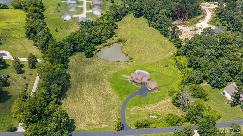 Rare opportunity to own gorgeous rolling acreage with a stocked pond and rippling creek, just outside Touchdown Estates on Linebacker Run.  Flexible size available from 4 to 7 acres depending on preferred layout (subject to seller approval) priced at $80,000 per acre.  Great location just north of Cape Girardeau and east of Jackson with easy I-55 access in Jackson R-2 school district.  This secluded, tree-lined tract is an awesome opportunity for those seeking a private retreat without any zoning or deed restrictions.  With its versatile potential and ideal location, this property is a compelling parcel for someone looking for a dream estate, hobby farm, or equine property!