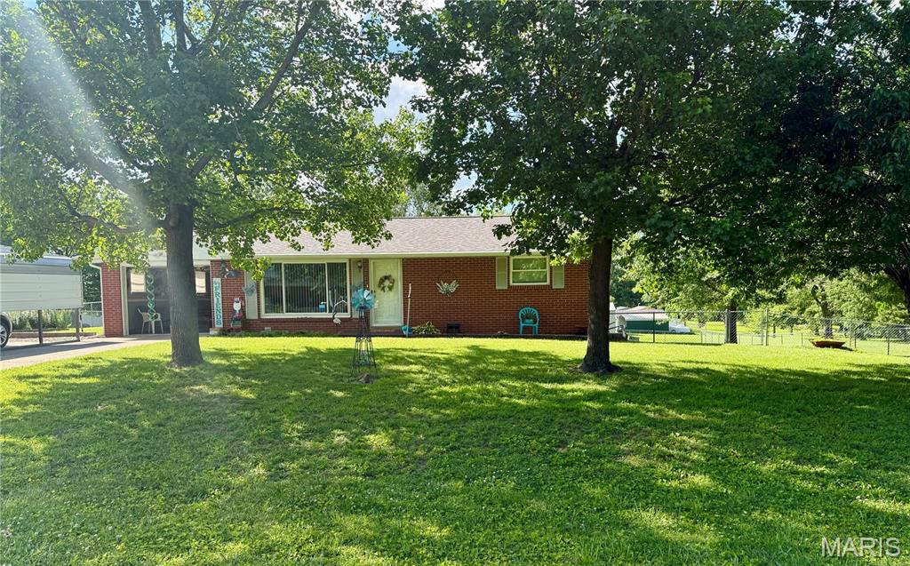 Some homes simply feel loved—and this is one of them.

Situated on over half an acre on a corner lot just minutes from town, this darling
brick home has been cared for with remarkable pride. Immaculately maintained
inside and out, it offers the kind of warmth and comfort that's hard to find. With
a walk-out basement, spacious deck, and two outbuildings, there's plenty of room
to enjoy both the practical and personal sides of homeownership. Clean, inviting,
and truly move-in ready, this is a place where it's easy to picture making
memories for years to come.