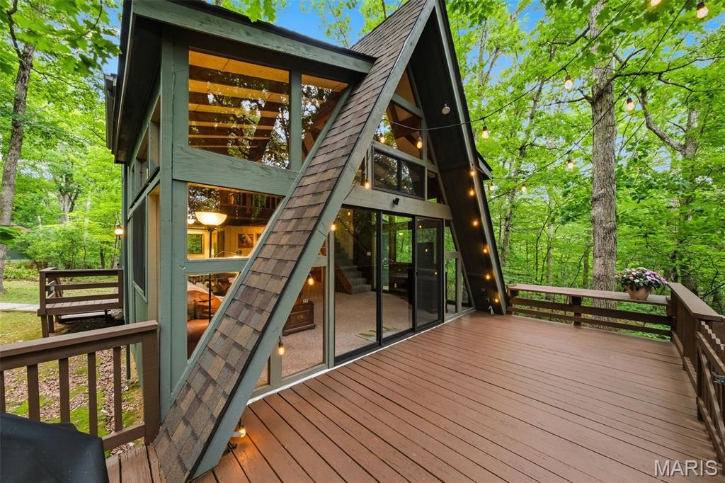 Could Be Yours — Turn-Key (with a few exceptions)!
Incredibly private and nestled on 2.9 acres of beautiful hardwoods and cedars, this Timberline chalet offers the perfect blend of seclusion and lake living on White Heron Lake. Step inside to an inviting open floor plan featuring stunning floor-to-ceiling wraparound windows that fill the home with natural light and showcase the surrounding beauty. The chalet includes 2 bedrooms, 2 full baths, and an oversized sleeping loft, providing plenty of space for family and guests.
Recent improvements make this property truly move-in ready, including a new roof (November 2025) and fresh exterior stain on the chalet and newer shed (2026). The deck, walkway, and private lakeside dock were newly stained in 2026, enhancing both the beauty and longevity of the outdoor spaces. The newer shed features a concrete floor and electricity, providing excellent storage, workshop space, or room for all your lake toys.
Enjoy peaceful mornings overlooking the water from your private dock, evenings on the spacious deck, and the unmatched privacy that comes with nearly 3 acres of wooded surroundings. Even better, you're just moments away from the fabulous beach on 45-acre St. Gallen Lake, one of Innsbrook's most sought-after recreation areas, offering swimming, sand volleyball, and endless opportunities for lakeside fun.
A rare opportunity to own an exceptionally private, beautifully maintained lake retreat with both waterfront serenity and convenient access to one of Innsbrook's premier beaches.