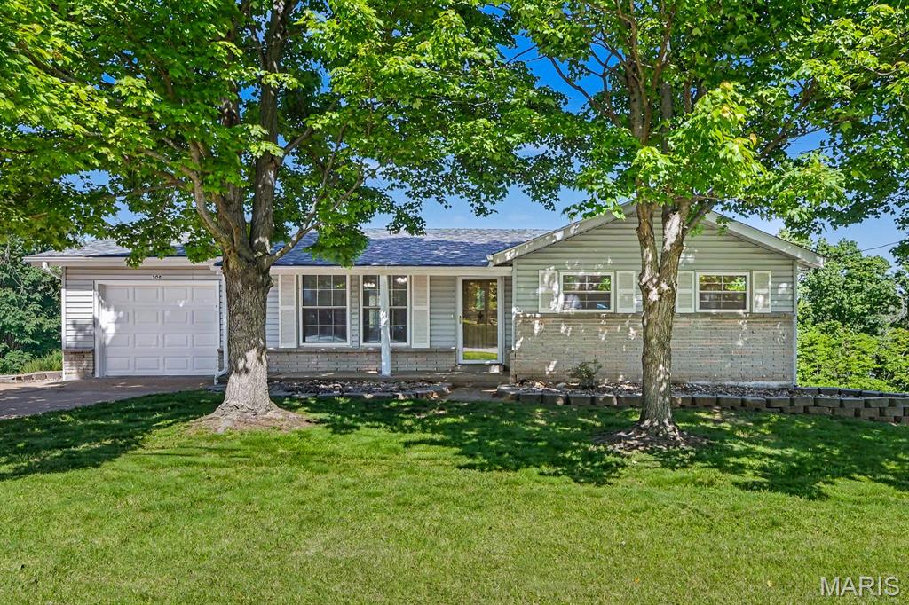 Welcome to your dream home in Arnold, Missouri! This charming 3-bedroom, 1-bathroom ranch is a true gem. From the moment you pull up, you will fall in love with the classic brick-and-siding exterior. Three mature shade trees frame the front yard beautifully, offering wonderful curb appeal. Step inside to find a warm, bright, and inviting space. The main floor features gorgeous original hardwood floors that bring so much character to the home. The seller has recently repainted several rooms, giving the entire house a clean, fresh, and modern feel. In the kitchen, you will find brand-new luxury vinyl plank (LVP) flooring. One of the best highlights of this property is the wonderful four-seasons room built right onto the back of the home. This bright bonus space lets you enjoy nature all year long, whether you are sipping morning coffee or unwinding after a long day. Love the outdoors? This home sits on a massive 0.67-acre lot! The yard has been meticulously cared for and features lush, green grass. A large portion of the backyard is fully fenced, creating a secure space for outdoor activities. In addition, you will find a handy storage shed to keep your lawn tools organized and tucked away. The attached garage has also been freshly painted, offering a clean setup for your vehicle or extra storage. Downstairs, the large unfinished basement is a blank canvas. It is clean, wide open, and waiting for your creative finishing touches. You can easily turn it into a home gym, a game room, or a workshop. Location is everything! This property sits in a quiet, quaint neighborhood, which means you get a peaceful atmosphere. Even better, you are just minutes away from local shopping, grocery stores, gyms, and great restaurants. Everything you need is right around the corner! Whether you are looking to purchase your very first home or searching for the perfect place to downsize, this move-in-ready property fits the bill. It combines classic charm with smart updates in a fantastic community. Opportunities like this do not last long in Arnold! Don't miss your chance to see this beautiful home in person. Call today to schedule your private showing before it is gone!