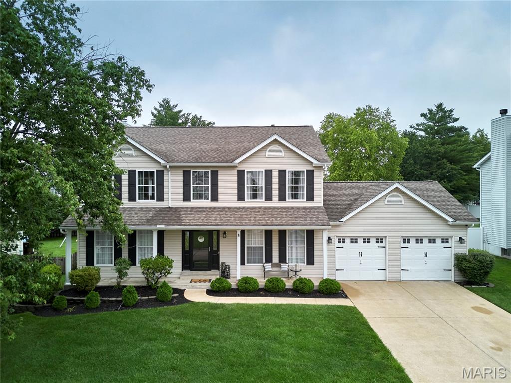 Located in the award-winning Francis Howell School District, this stunning 2-story home offers a private backyard oasis featuring an above-ground pool, composite deck, and concrete patio. Inside, an elegant foyer with gleaming hardwood flooring leads to a private home office and formal dining room. The main floor boasts a gourmet kitchen with a center island, opening directly to a family room with a cozy wood-burning fireplace. Upstairs, discover a spacious primary retreat with a walk-in closet and a luxury en suite bath featuring a double vanity, soaking tub, and separate shower. Three additional large bedrooms and a full bath complete the upper level. The finished lower level adds incredible value, offering a dedicated sleeping room, a half bath, a large TV area, a flex/game room, and a built-in bar. Enjoy an unbeatable location close to Highway 94, shopping, dining, and premier entertainment!