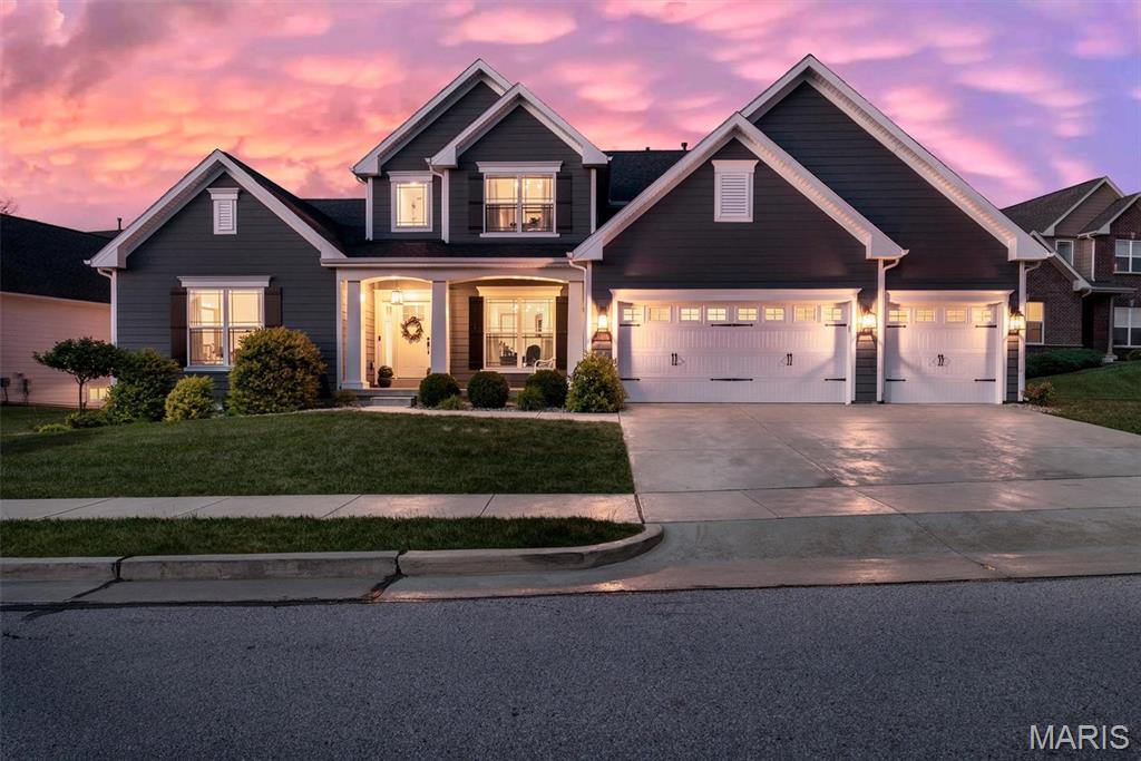 OPEN HOUSES CANCELLED.  Welcome home to 2421 August Grove Court, a beautifully crafted Fischer & Frichtel residence offering more than 5,000 square feet of refined living space designed for comfort, style, and effortless everyday living. Sunlight fills the two-story foyer and highlights the wide-plank hardwoods and custom millwork, leading you into the great room where gatherings naturally center around the gas fireplace and built-ins. The kitchen is both elegant and functional with quartz counters, custom white cabinetry, double ovens, a walk-in pantry, and a generous island that brings everyone together. A bright breakfast room, formal dining room, and main-floor office add flexibility for hosting, working, and relaxing. The main-floor primary suite offers a peaceful retreat with a walk-in closet and a spa-inspired bath featuring double vanities, a soaking tub, and a walk-in shower. Upstairs, four bedrooms with walk-in closets provide comfortable personal space for family or guests. The finished lower level expands the home’s lifestyle potential with a recreation room, a second fireplace, a stylish dry bar, a game-day ready family room, and a charming under-stair playhouse. Step outside to a fenced yard with a stamped concrete patio, ideal for relaxed evenings or weekend entertaining. With Hardie siding, a three-car garage, zoned HVAC, an irrigation system, and convenient access to parks and schools, this home blends thoughtful design with everyday luxury. Experience the best of Wildwood living at 2421 August Grove Court. Schedule your showing today!