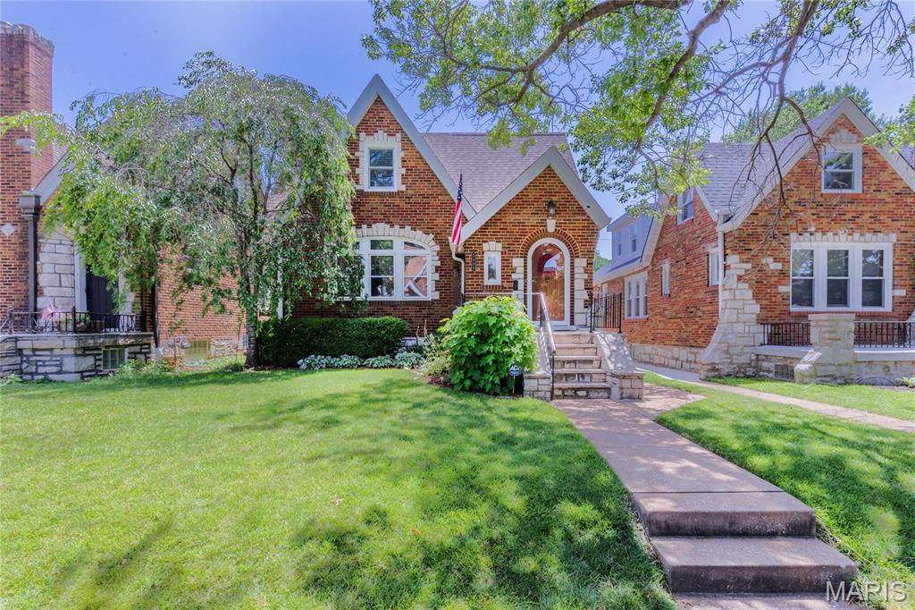 Some homes are renovated. This one has been thoughtfully reimagined while keeping every ounce of the charm that made it special in the first place. Tucked into the heart of Northampton, this storybook gingerbread delivers all the character you've been hoping for—arched doorways, stained glass, a beautiful fireplace, and timeless details around every corner. The classic layout unfolds just as it should: an inviting living room, formal dining room, and then...the kitchen. And what a kitchen it is. Crisp white cabinetry, gorgeous tilework, a custom breakfast nook, pantry, and finishes that feel right at home without trying too hard. Two bedrooms and a full bath anchor the main floor, while upstairs is the surprise you didn't know you needed. A true primary suite offers multiple closets, double sinks, a soaking tub, separate shower, and enough storage to make you forget you're in a 100-year-old home. An additional spacious bedroom completes the second floor. The partially finished basement adds the perfect flex space for movie nights, playtime, or game day, along with a half bath and plenty of storage. Outside, enjoy a fully fenced backyard, a two-car garage, and peace of mind thanks to a new roof, Anderson windows, newer HVAC, and basement waterproofing. Just blocks from Piper's, Russell's, Golden Hoosier, and everything that makes Northampton one of South City's favorite neighborhoods, this is the kind of home people wait for—and for good reason.