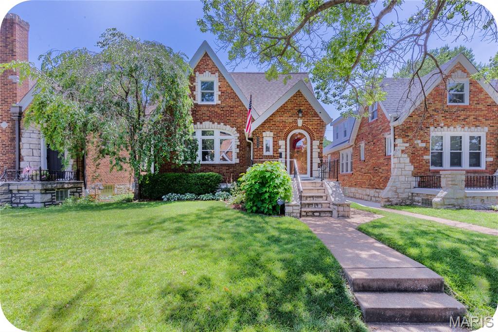 Some homes are renovated. This one has been thoughtfully reimagined while keeping every ounce of the charm that made it special in the first place. Tucked into the heart of Northampton, this storybook gingerbread delivers all the character you've been hoping for—arched doorways, stained glass, a beautiful fireplace, and timeless details around every corner. The classic layout unfolds just as it should: an inviting living room, formal dining room, and then...the kitchen. And what a kitchen it is. Crisp white cabinetry, gorgeous tilework, a custom breakfast nook, pantry, and finishes that feel right at home without trying too hard. Two bedrooms and a full bath anchor the main floor, while upstairs is the surprise you didn't know you needed. A true primary suite offers multiple closets, double sinks, a soaking tub, separate shower, and enough storage to make you forget you're in a 100-year-old home. An additional spacious bedroom completes the second floor. The partially finished basement adds the perfect flex space for movie nights, playtime, or game day, along with a half bath and plenty of storage. Outside, enjoy a fully fenced backyard, a two-car garage, and peace of mind thanks to a new roof, Anderson windows, newer HVAC, and basement waterproofing. Just blocks from Piper's, Russell's, Golden Hoosier, and everything that makes Northampton one of South City's favorite neighborhoods, this is the kind of home people wait for—and for good reason.