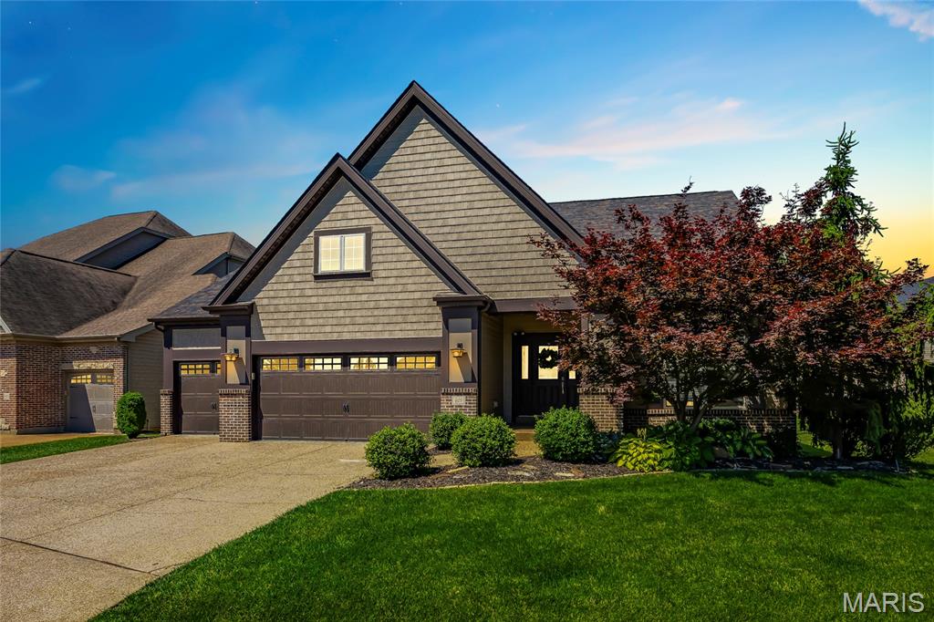 Stunning ranch-style home located in the sought after subdivision of Tuscany in St Charles! This home boasts 4 bedrooms, 3 full bathrooms, over 3,600 square feet of living space. 

The front door opens to the entry foyer which leads to the formal dining room and spacious living room with a wall of windows. The kitchen boasts granite countertops, staggered cabinetry with crown molding, a tile backsplash, newer microwave, newer double oven with air fry mode, tile floors, and a dining area. 

The primary bedroom features a walk-in closet and luxurious bathroom with tile floors, dual vanities, a corner soaking tub, and a separate shower with a bench. Two additional bedrooms and a full hall bathroom complete the main level.

The finished lower level boasts a huge recreation room with a kitchen area and electric fireplace, a 4th bedroom with a walk-in closet, a sleeping room/office, and ample storage space.

Other highlights include: new roof (2023), 3 car garage with epoxy coated floor and attached tool hanger, newer Malibu wide plank French Oak hardwood floors in the living room and dining room, newer carpeting throughout, wrought iron spindles, arched 2 panel doors throughout, newer water softener, and a newer front load washer and dryer with pedestal which are included. 

Relax outside on the back patio and enjoy the spacious yard with professional landscaping. Location could not be better – close to highway 364, other major highways, restaurants, shops, schools, Streets of St Charles, and St Charles Historic Main Street!