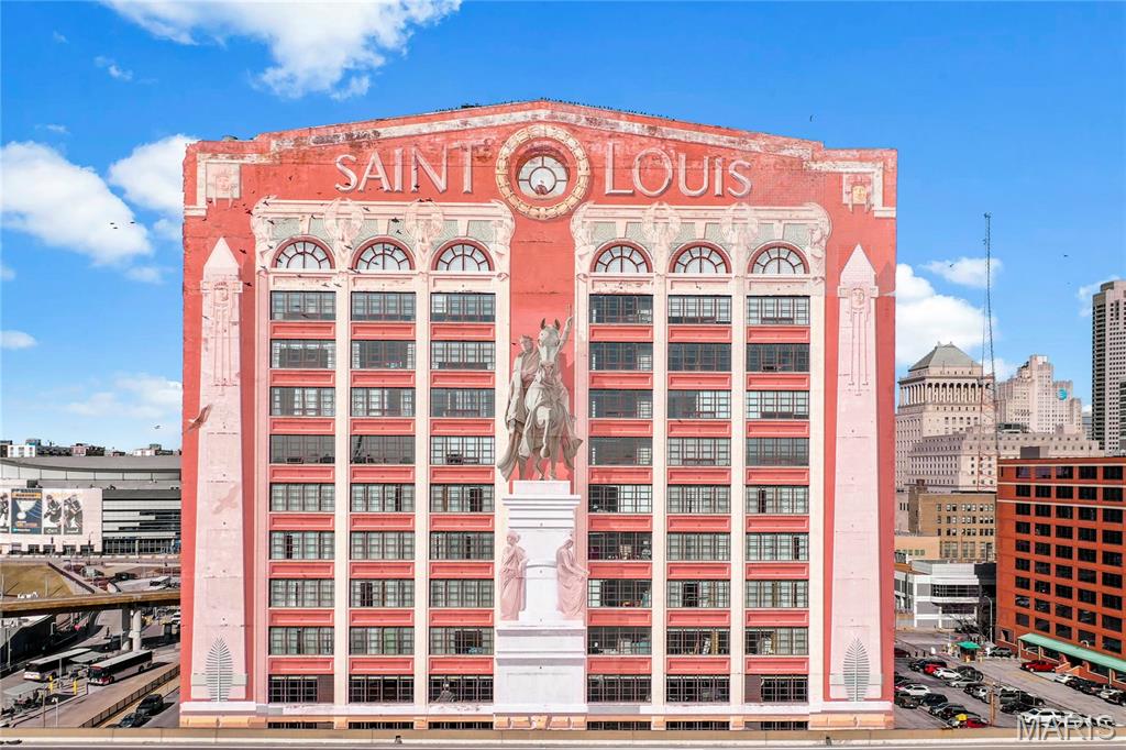 This isn't just a home, this is a lifestyle declaration, a sky-high love letter to St. Louis wrapped in Art Deco bones, soaked in history, and served with a view that will make your jaw hit the hardwood floors. These walls have held laughter, celebrations, quiet Sunday mornings with coffee and that Arch glowing in the distance, and more memories than any listing description could ever do justice to. For the author of From the Outhouse to the Penthouse, Tessa Greenspan, letting go of Unit 910 is one of the hardest things she has ever done, because when a home fills your soul the way this one has, it stops being real estate and starts being part of who you are.

Welcome to 400 South 14th Street, Unit 910 in the legendary Edison Brothers Building, one of downtown's most iconic addresses and soon to be its most spectacular one. Originally built in the late 1920s and proudly listed on the National Register of Historic Places, this Art Deco icon is wrapped in a monumental trompe l'oeil mural painted in 1984 by celebrated artist Richard Haas, depicting scenes from the 1904 St. Louis World's Fair, the event that gave us the ice cream cone and "Meet Me in St. Louie" (priorities intact), and as part of the Midas renovation, Haas himself is returning to restore it to full glory because your building isn't just getting renovated, it's getting its portrait retouched by the original artist. 

This stunning 3 bedroom, 2.5 bath corner unit offers sweeping views to the south and east with the St. Louis Arch, Anheuser-Busch, and the downtown skyline as your daily backdrop, because sunrises here are not alarm clocks, they are events. The open concept layout was made for entertaining, anchored by an exquisite three-sided fireplace that will stop every guest in their tracks, complemented by a beautiful built-in buffet offering generous storage while keeping the space as tasteful and inviting as the rest of this lovingly maintained home, and two separate ensuite bedrooms offer privacy and comfort for everyone under the roof, while a brand new high efficiency HVAC installed just last year keeps you perfectly comfortable in every season without a worry in sight.

Now for the headline: Midas Hospitality has announced an $81 million renovation of this very building, transforming it into the Sheraton St. Louis Downtown with branded hotel rooms, a rooftop deck, expanded event space, and a Sports Bar and Grill facing 14th & Clark, all set to open fall of 2027, making this the only building in downtown St. Louis where you buy in now and watch your investment grow from day one, built-in equity before you even unpack. Step outside and the entire city is your backyard, with the Home of the St. Louis Blues Hockey Club across the street, Busch Stadium, Energizer Park, Stifel Theatre, Ballpark Village, and Union Station all within easy reach, and the MetroLink right across the way for effortless access to Lambert Airport or Amtrak connections to Chicago and Kansas City, plus two prime secured parking spaces included because in downtown St. Louis that is worth its weight in gold, all wrapped in the comfort of around the clock building security so you sleep easy every single night. 

Tessa has lived the journey from the outhouse to the penthouse and can tell you with her whole heart that Unit 910 is not just where she has lived, it is where she has truly thrived, where she has watched this city light up at night and felt nothing but gratitude for every single moment spent inside these walls and the sense of community in the building. Now it is time to pass that joy, that energy, and that one of a kind life to someone who is ready to receive it fully. This is not just a home purchase. This is a front-row seat to the renaissance of downtown St. Louis, and you deserve a front-row seat. Schedule your private showing today because Unit 910 will not wait, and neither should you.