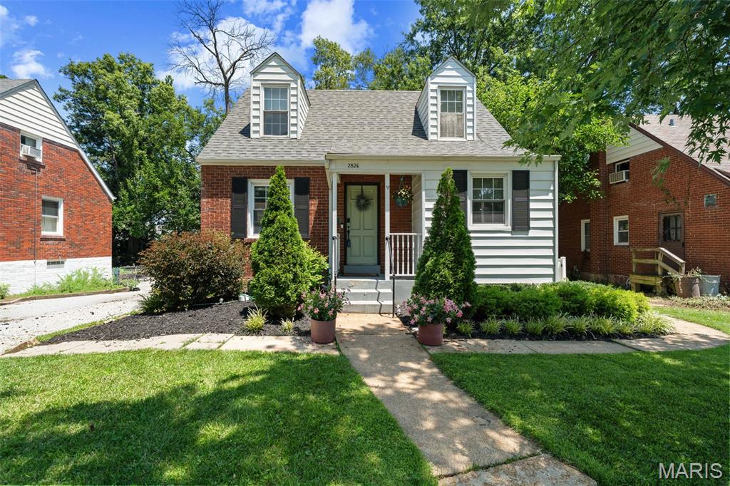Welcome home to 2826 Dunkirk Drive ... Offering 3 bedrooms and 2 full baths, this move-in ready home blends timeless charm with thoughtful updates throughout. The inviting main level features hardwood floors and abundant natural light in a cozy living room, separate dining room with custom built-in bar, and kitchen with a door to the side yard that leads to the patio strung with bistro lights, as well as a fire pit in the fully-fenced, level yard. The flexible floor plan includes a main-floor bedroom and full bath, while the upper level boasts a spacious primary suite, the 3rd bedroom, and the second full bath. The full walk-out lower level houses the laundry area, provides excellent storage, and gives you future finishing potential. Conveniently located near parks, shopping, restaurants, and major highways, this home offers the perfect combination of character, updates, and location. Don't miss this Rock Hill gem in the highly sought-after Webster Groves School District!