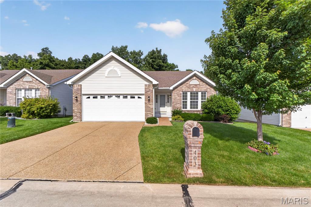 BACK ON THE MARKET through no fault of the seller! The previous buyer was unable to satisfy their home sale contingency, giving you a second chance to make this beautiful home yours. Maintenance-free detached villa offering the perfect blend of comfort, convenience, and carefree living in desirable Ellington Place! This beautifully maintained 2-bedroom, 3-bath ranch features an inviting open floor plan with soaring vaulted ceilings, freshly painted and brand-new carpet throughout, and a cozy gas fireplace that anchors the great room and dining area. The spacious kitchen is designed for both everyday living and entertaining, complete with a raised breakfast bar, ample workspace, and a refrigerator that stays with the home. Just off the main living area, a composite deck with retractable awning, overlooks mature trees, creating the perfect setting for morning coffee or relaxing evenings outdoors. The main level offers two bedrooms and two full baths, including a spacious primary suite with a large walk-in closet and a luxury bathroom featuring a shower and large linen closet. The hall bath includes a premium Safe Step walk-in tub for added comfort and accessibility. Main-floor laundry and a finished two-car garage provide everyday convenience and comfort. The finished walkout lower level expands your living space with a large recreation/family room, full bathroom, and access to a private patio—ideal for entertaining, guests or hobbies. The unfinished portion of the basement offers ample storage space. Enjoy a truly low-maintenance lifestyle with HOA services that include lawn care, mulching, snow removal, and irrigation. Conveniently located in the heart of St. Peters, Ellington Place offers easy walkability to parks and the YMCA, with quick access to highways, shopping, dining, and everyday amenities. Move-in ready and designed for easy living, this exceptional villa is ready to welcome you home!