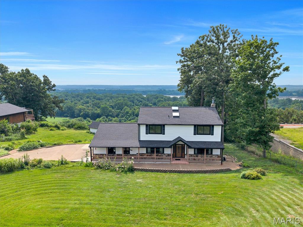 COMING SOON! Discover breathtaking views from this updated 4-bed, 4-bath Unincorporated-Saint Louis County retreat set on a private, wooded 1.25-acre lot. Skylights throughout fill the home with warm, natural light, highlighting luxury vinyl plank floors and spacious living areas. The spacious kitchen features granite counters, custom cabinetry, a pantry, and a separate dining area. The family room’s wood-burning fireplace anchors the main level, while the expansive 37’ 4-Seasons room showcases the stunning scenery. Upstairs offers four generous bedrooms, including a large primary suite with a walk in closet and private bathroom. The walkout lower level features a rec room, exercise room, office, full bath, and second 4 seasons room. Updated-All new roof/siding/gutters, Andersen windows, remodeled, and truly a must-see!! Lookout deck and unstocked koi pond in the back! More pics to come!