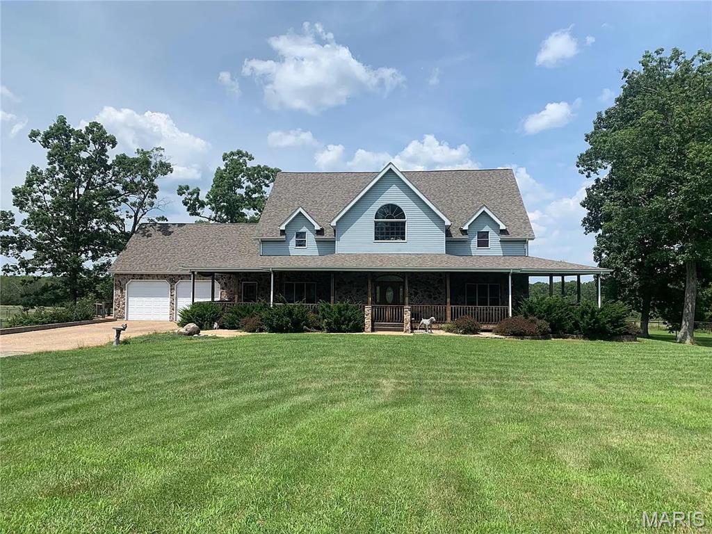 Welcome to this exceptional 42.42± acre estate, a one-of-a-kind property that blends luxury living, premier equestrian amenities, and outstanding facilities for canine enthusiasts. This meticulously maintained property offers endless possibilities for horse lovers, dog trainers or breeders, hobby farmers, or anyone seeking an incredible country lifestyle.

Conveniently located on a blacktop road with easy interstate access, the property is just 5 minutes from Cuba and approximately 1 hour from St. Louis. The beautifully designed 3,200± sq. ft. home features 4 bedrooms, 4.5 bathrooms, two fireplaces, an impressive finished walk-out lower level, and spacious front and rear decks, including a covered 16-foot deck overlooking the picturesque acreage.

A standout feature of the property is the professionally designed kennel facility, thoughtfully equipped for breeding, boarding, training, or other canine-related ventures. Complete with specialized amenities, this impressive setup is a rare opportunity for anyone looking to establish or expand a dog-related business.

Horse enthusiasts will appreciate the exceptional equestrian amenities, including a 36' x 36' barn with four 12' x 12' stalls, automatic waterers, feed bunks, an attached 24' x 36' heated shop/storage area with concrete floors, and durable pipe-fenced paddocks throughout the property.

The gently rolling 42.42± acres feature two ponds, making the property ideal for livestock, recreation, fishing, or simply enjoying the peaceful country setting. A central outdoor wood-burning furnace provides efficient supplemental heat with electric backup.

Whether you're searching for an exceptional horse property, a turnkey canine facility, or a private country estate with outstanding improvements, this remarkable property offers a rare combination of quality, versatility, and convenience. Properties of this caliber don't come along often—schedule your private showing today!

*Full photo gallery coming soon.