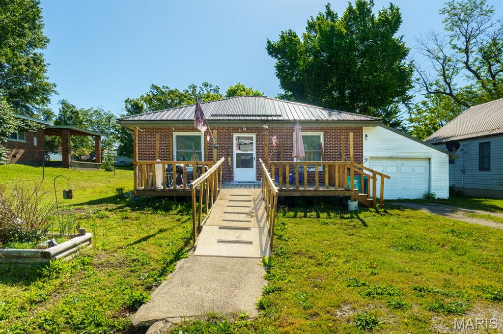 Welcome home to this charming all-brick 2 bedroom, 1 bathroom property located in the heart of Belle, Missouri. This home offers timeless character with an arched kitchen entryway, built-in hallway storage, and generously sized bedroom closets. Enjoy the added convenience of a mudroom, oversized garage, and attached storage shed for extra space. Step outside to a large fenced backyard with plenty of room to relax, entertain, or garden. A wonderful blend of charm, functionality, and small-town living!