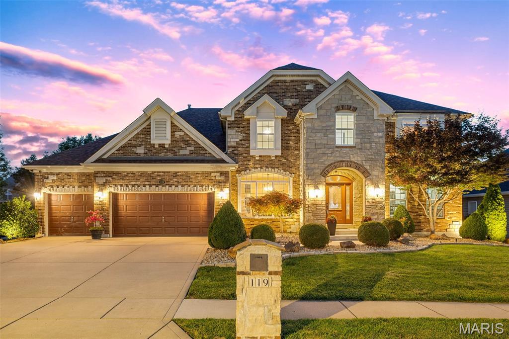WELCOME TO 119 ELDERBERRY LANE: A stunning 4-bedroom, 3.5-bathroom Barclay model home nestled on a prime cul-de-sac lot in the sought-after Enclaves at Cherry Hills community in Wildwood, Missouri. /// EXCLUSIVE PRIVACY:  Tucked away on an ultra-low-traffic street shared by only 13 homes, this property offers a rare level of peace. Offering over 3,500 square feet of beautifully designed living space, this 1.5-story home strikes the perfect balance between everyday comfort and elevated entertaining. /// MAIN LEVEL: Gleaming newer hardwood floors welcome you at the entry and carry you through the main level, immediately setting the tone for the warmth and craftsmanship found throughout the home. The soaring two-story great room is the true heart of the home, anchored by a dramatic stone gas fireplace and framed by a wall of windows that bathe the space in natural light throughout the day. /// GOURMET KITCHEN: Designed to impress with featuring granite counters, custom wood cabinetry, and a full suite of stainless steel KitchenAid appliances, including a gas cooktop, double wall oven, built-in microwave, dishwasher, and freestanding refrigerator. A coffee bar, wine rack, dedicated planning desk, pantry, and a large center island with a breakfast bar round out this exceptional space. The separate dining room sits adjacent to the kitchen and offers an elegant setting for more formal gatherings, with large windows keeping the space light and airy. /// PRIMARY BEDROOM RETREAT: The main floor primary suite features hardwood flooring throughout. The en-suite primary bathroom features a corner soaking tub, double vanity, separate water closet, a generously sized separate shower, and a spacious walk-in closet. The main level is completed by a dedicated laundry room and a convenient half bathroom. /// UPSTAIRS: A large recreation room provides a versatile flex space perfectly suited for entertaining family and guests, and could easily be transformed into a dedicated media room. Three additional bedrooms complete the upper level, with one bedroom enjoying a private ensuite bathroom, while the other two are connected by a shared jack-and-jill bathroom.  /// OUTDOOR OASIS & AMENITIES: Step outside from the main level bay window through the back to a large wood deck overlooking the backyard, which leads directly to a screened gazebo complete with a hot tub, creating a private outdoor retreat you will love year-round. The professionally landscaped backyard is both a showpiece and a sanctuary, featuring a full in-ground irrigation system and architectural landscape lighting that transforms the property into something truly special after dark. The Enclaves at Cherry Hills community offers exceptional amenities, including a neighborhood pool, a serene three-acre fishing lake with walking trails, and is conveniently located just minutes from Fairway Elementary School, and is close to grocery stores, local restaurants, and premier shopping.