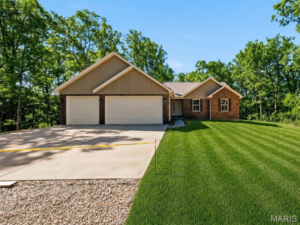 MOVE IN READY!!!!  Immediate possession available on this beautiful new home situated on 4.13 acres! This 1,595 sq. ft. ranch backs to wooded privacy and offers a wonderful view of the surrounding forest from the covered rear deck. Inside, you’ll find luxury vinyl plank flooring throughout, a 12-foot vaulted ceiling in the living room, and beautifully tiled ceramic showers. The home also includes a 3-car attached garage, main-floor laundry, and a walk-out basement with plumbing rough-in ready for future expansion. The kitchen/dining combo shines with granite countertops, canned lighting, shaker soft close cabinets and stainless-steel Whirlpool appliances & sliding door to back deck overlooking the hills for the perfect fall views & spacious backyard. The primary en-suite boasts a separate tiled shower & soaking tub with plenty of natural lighting.  Nice country setting at the end of a quiet country lane. *Please note lawn pictures have been edited.