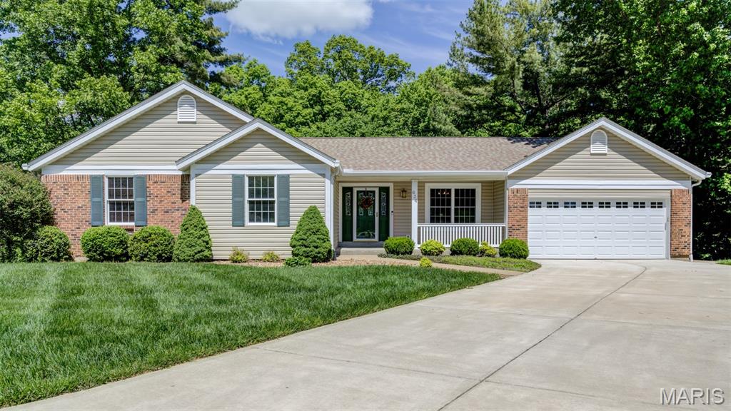 Sprawling 3 Bed.,3 Bath ranch nestled on a quiet cul-de-sac lot backing to heavy trees for added privacy and peaceful views. This home features vaulted ceilings, 2 cozy fireplaces, and an open airy layout with fresh paint throughout the entire home. The main floor offers a separate Dining Room, convenient Laundry, and a bright Sunroom perfect for relaxing. The finished walk-out lower level provides additional living and entertaining space with endless possibilities for a family room and recreation room. Enjoy lush landscaping with inground sprinklers and recent exterior updates, including brand-new siding and roof, giving this home excellent curb appeal and peace of mind. Additional features includes central vacuum and plenty of storage throughout. Experience the perfect combination of privacy and updates in this beautiful ranch home.