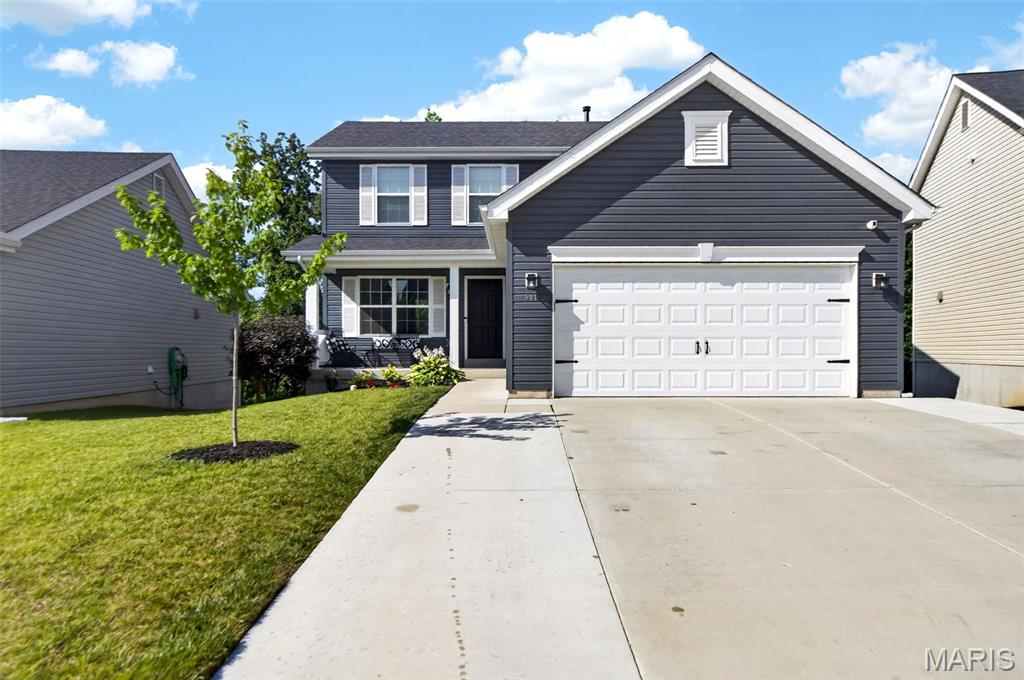 Welcome to this beautifully updated 4-bedroom, 3.5-bath home in the highly sought-after Cobblestone Crossing community. This move-in-ready property offers modern comfort and family friendly living just a short walk from Mount Hope Elementary. Fresh updates include brand new luxury plank flooring throughout the main level and fully finished basement, plus new carpet upstairs. The kitchen features a large center island and opens seamlessly via sliding doors to a spacious composite deck for effortless indoor/outdoor entertaining.  The standout is the fully permitted lower level a true luxury basement retreat with generous 6 foot-double-tall double hung windows and a large slider for abundant natural light, a large walk-in closet and a well appointed bathroom with heated tile floors. With its own full bath and excellent privacy this versatile space is ideal as a guest suite, teen retreat, home office, gym, or additional living space,   Outside, enjoy a flat private backyard that backs to a peaceful creek in the common ground, plus an oversized 3-car driveway. A new roof (2025) and five-year-old utilities provide added piece of mind. Located in the Fort Zumwalt R-II School District, the home offers unbeatable convenience with walkable access to Mount Hope Elementary, close to parks, shopping, dining and top rated schools.  A recent pre-listing inspection was clean, confirming the home is well maintained and move in ready.  This home is one you don't want to miss.
