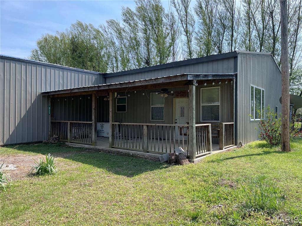 Great location in town but off the beaten path. Metal sided shop house with attached storage area, workshop and massive 32 x 52 garage. House gives off cabin vibes with vaulted ceilinged living room, separate kitchen and dining room, 3-bedrooms, 2-baths, large laundry room and upstairs bonus room. Cozy car siding, dark wood accents and tin ceilings add to the charm. Covered front porch for evening entertaining. There's so much room for side x sides, 4-wheelers, campers and all the supplies you need for a weekend of fun. Explore numerous hiking and biking trails, Clearwater Lake, Sam A. Baker and Black River.