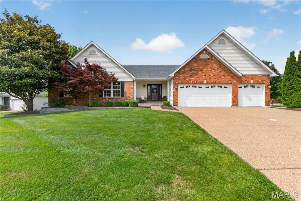 Welcome home to this spacious atrium ranch located in a highly sought-after area, offering over 3,200 sq. ft. of finished living space, including a beautifully finished walkout lower level. Situated on a spacious corner lot, this partial brick-front home with a newer front door showcases professional landscaping with mature plantings, landscape lighting, enclosed soffits and fascia, an aggregate driveway and walkway, and outstanding curb appeal.
Featuring 4 bedrooms, 3 full baths, a private office/flex room, and a 3-car garage, this home is ideally located near grocery stores, shopping, restaurants, and offers quick access to Highway K and Highway 364 for an easy commute. The open floor plan is enhanced by an impressive atrium staircase and a dramatic wall of windows that fills both levels with natural light. A spacious foyer welcomes you into the vaulted great room with ceiling fan, which flows seamlessly into the kitchen. The kitchen features granite countertops, a tile backsplash, breakfast bar seating, a planning desk, and abundant cabinetry. A convenient main-floor laundry room with a window is located just off the kitchen and garage. The vaulted primary suite offers a walk-in closet and private en-suite bath, while the main-level bathrooms are appointed with tile flooring and granite-topped vanities. The finished walkout lower level seamlessly extends the living space and opens to the beautifully landscaped, level backyard, providing plenty of room for outdoor gatherings and recreation. Designed for both entertaining and everyday living, the lower level features a spacious family room, theater or recreation area, a cast-iron stove resting on a granite hearth with thermo-remote control, custom built-in bookshelves and storage cabinets, recessed lighting, and a kitchenette complete with sink, cabinetry, and refrigerator that will remain with the home. A fourth bedroom, full bath, and private office/flex room provide comfortable accommodations for guests, extended family, or potential in-law quarters. Additional highlights include a covered front porch, rear patio, and a 3-car garage equipped with two heaters. This move-in-ready home combines generous living space, quality features, and an unbeatable location.