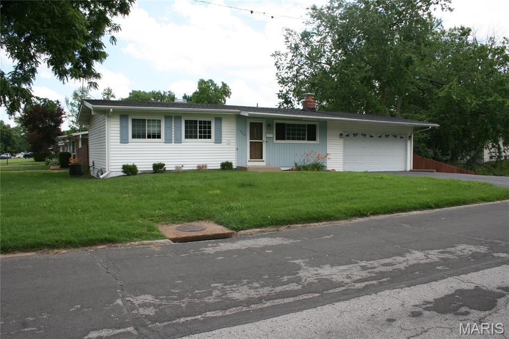 Outstanding opportunity to buy a 3 bed 2 full bath ranch with a fully finished lower level that adds family room, laundry / utility/ storage room, 2 bonus rooms, 2nd full bathroom and brick fireplace!   Main level offers living room and 3 bedrooms with hardwood flooring, (all with double closets), remodeled full bathroom.   Nicely equip kitchen with gas range, breakfast bar, and skylight that adds tons of natural light.  Sliding glass door leads to wood deck and huge covered patio, wood privacy fenced yard perfect for your pets.  Thermal, tilt-in windows thru out main floor.  Updated plumbing and electric.  Oversized 2 car garage with work shop bonus room with storage shelving.