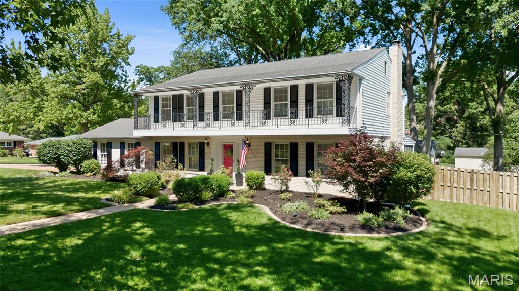 Welcome to this beautifully maintained 4 bed, 2.5 bath brick home in the heart of Kirkwood! Nestled on a gorgeous lot just one block from Lindgate Manor Swim Club, this neighborhood is eligible to join one of the area’s most sought-after community pools. Inside, you’ll find hardwood floors, crown molding, six-panel doors throughout, and spacious living areas designed for both everyday living and entertaining. The inviting family room features a gas fireplace and built-in audio speakers, creating the perfect gathering space. The updated kitchen offers abundant storage with TWO pantries and flows seamlessly into the dining and living spaces. An adorable main-level powder room adds the perfect touch of charm for guests. Upstairs features generously sized bedrooms, including a spacious primary suite and beautifully updated baths, both with double sinks. Step outside and you’ll fall in love with the incredible outdoor living spaces. The large screened-in porch feels like an extension of the home and is the perfect spot for morning coffee, summer dinners, or relaxing bug-free evenings overlooking the fenced backyard. Just beyond, the oversized deck, irrigation system, and raised vegetable garden make this outdoor area both functional and beautiful. Additional features include a fully drywalled 2-car garage, termite protection system, and new garage door springs for added peace of mind. This is the kind of home that rarely becomes available in Kirkwood, meticulously cared for, loaded with upgrades, and located in an incredible neighborhood close to Kirkwood's best restaurants, boutiques, coffee shops, farmers market, year-round community events and top-rated schools. Minutes from Kirkwood Park, which offers walking trails, playgrounds, sports fields, an aquatic center, tennis courts, and community amenities.