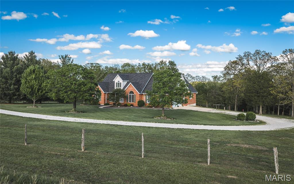 Located at 1276 Highway Y in the heart of Gasconade County, this exceptional 89-acre recreational and residential estate offers the rare combination of luxury country living, proven hunting ground, productive pasture, mature hardwood timber, and turnkey improvements in one of east-central Missouri’s most desirable outdoor regions. Positioned just outside Bland with convenient paved highway frontage, this property delivers privacy, accessibility, and four-season enjoyment.

          At the center of the property sits a beautifully maintained custom brick walkout ranch home offering approximately 3,040 square feet of finished living space. Built in 1998, the residence features three bedrooms, three bathrooms, and quality finishes throughout. Inside, cathedral ceilings create an open and inviting atmosphere, while granite countertops, spacious walk-in closets, and thoughtful custom details provide both comfort and functionality. The mostly finished lower level includes a custom bar and game room, creating the perfect setting for entertaining family, guests, or hunting partners after a day in the field.

          Step outside and the property continues to impress. The grounds surrounding the home have been meticulously landscaped with a manicured lawn, flowering trees, and mature pines that immediately showcase pride of ownership. A large metal outbuilding provides excellent storage for tractors, ATVs, hunting equipment, boats, or workshop space.
The 89 acres offer an outstanding blend of open pasture, mature timber, edge habitat, and natural travel corridors. A scenic pond and spring-fed valley create reliable year-round water sources while enhancing wildlife habitat on the property. The diverse topography creates stand locations, pinch points, and natural funnels, making this a serious hunting tract with a strong history of successful whitetail deer and turkey harvests.

          The property layout provides ample opportunities for additional food plots, trail systems, stand improvements, and habitat enhancement projects. Whether your goal is trophy deer management, turkey hunting, trail riding, hiking, or simply enjoying the outdoors, this farm is built to perform.
Conveniently located near Owensville in Gasconade County, the property puts everyday shopping, dining, healthcare, and essential services just a short drive away. Hermann, the Gasconade County seat known for its wineries and Missouri wine-country tourism, is also a short drive away.  Outdoor recreation extends far beyond the property boundaries. The nearby Gasconade and Bourbeuse Rivers offer outstanding opportunities for fishing, boating, kayaking, floating, and additional public-access hunting and recreation.

          Whether you are searching for a full-time residence, private family retreat, legacy hunting property, or investment-grade Missouri recreational holding, this Gasconade County farm offers the improvements, habitat, accessibility, and location to meet the highest expectations.