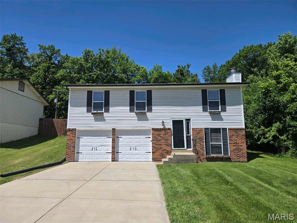 Welcome to Oak Bend! This 3-bedroom, 2-bathroom home is perfectly situated in a quiet cul-de-sac, offering the ideal blend of modern updates and a highly functional layout.

The open-concept floor plan flows seamlessly from the living room—featuring a cozy fireplace—into the heart of the home. The updated kitchen is a standout, boasting elegant granite countertops and stainless steel appliances. The interior is finished with durable vinyl and laminate flooring throughout. While the home is designed for comfort, the primary bedroom offers a spacious retreat with a large walk-in closet and a double-sink vanity.

Outside, you will find a fully fenced-in backyard and an attached 2-car garage. Located in the highly-rated Fort Zumwalt South school district, this home provides quick access to Highway 364 and Highway 70. You are just minutes from premier shopping, dining, and parks, with close proximity to Progress South Elementary and local plazas like Belleau Creek. This home combines suburban tranquility with total convenience.

Schedule your private showing today!
